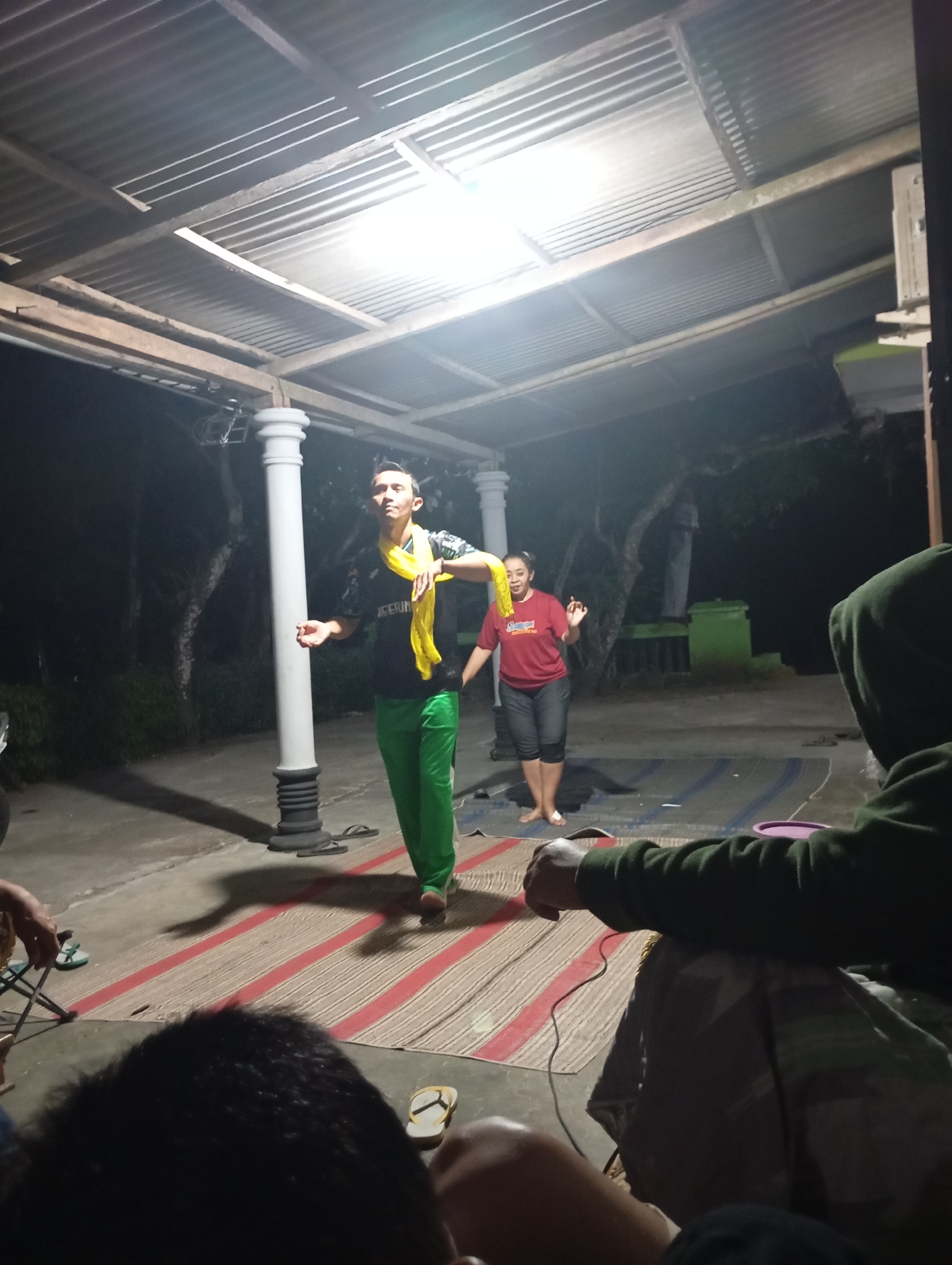 Traditional dance performance at a night gathering in rural Java