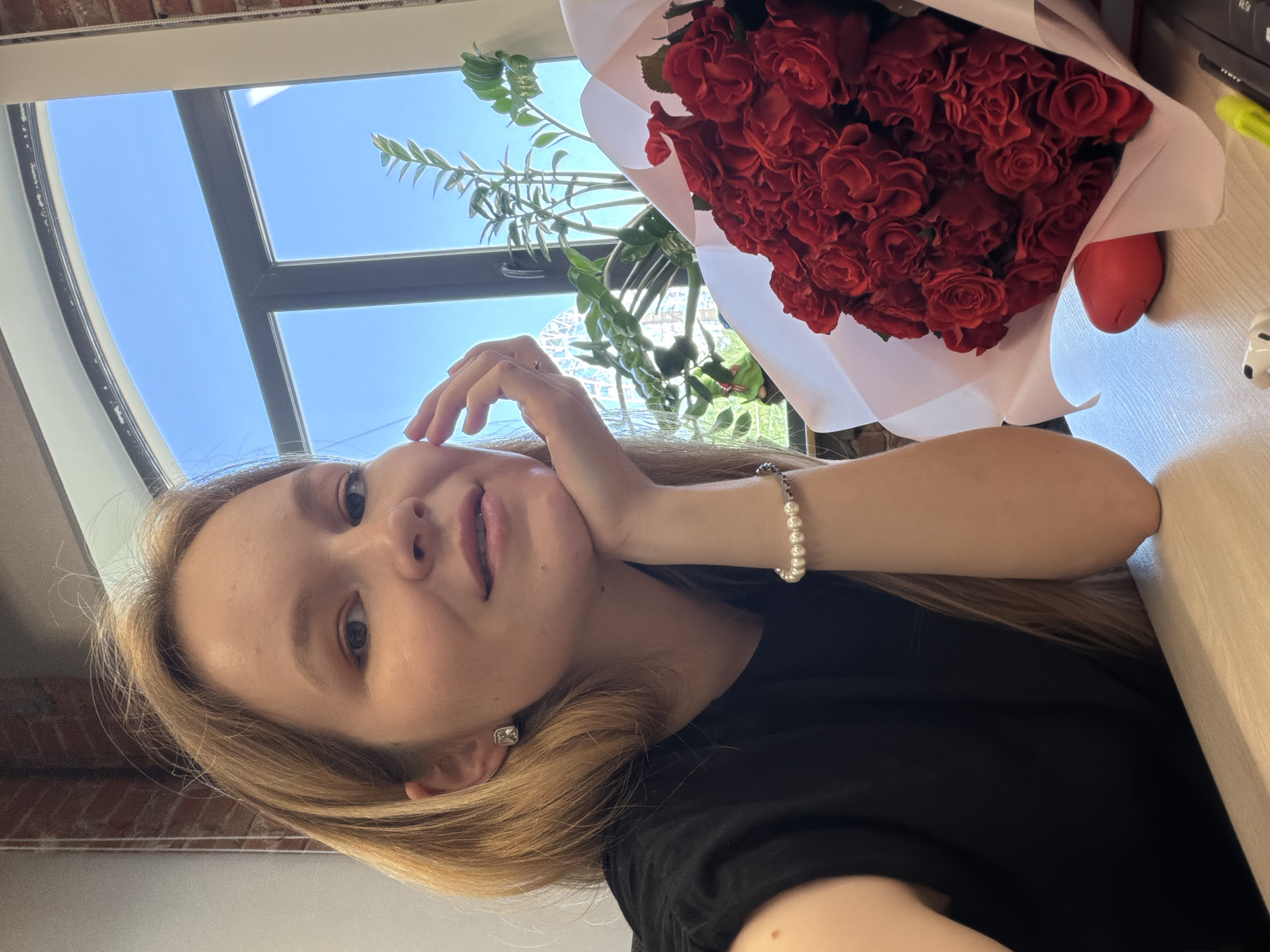 Woman documents receiving red roses in Izhevsk, Russia
