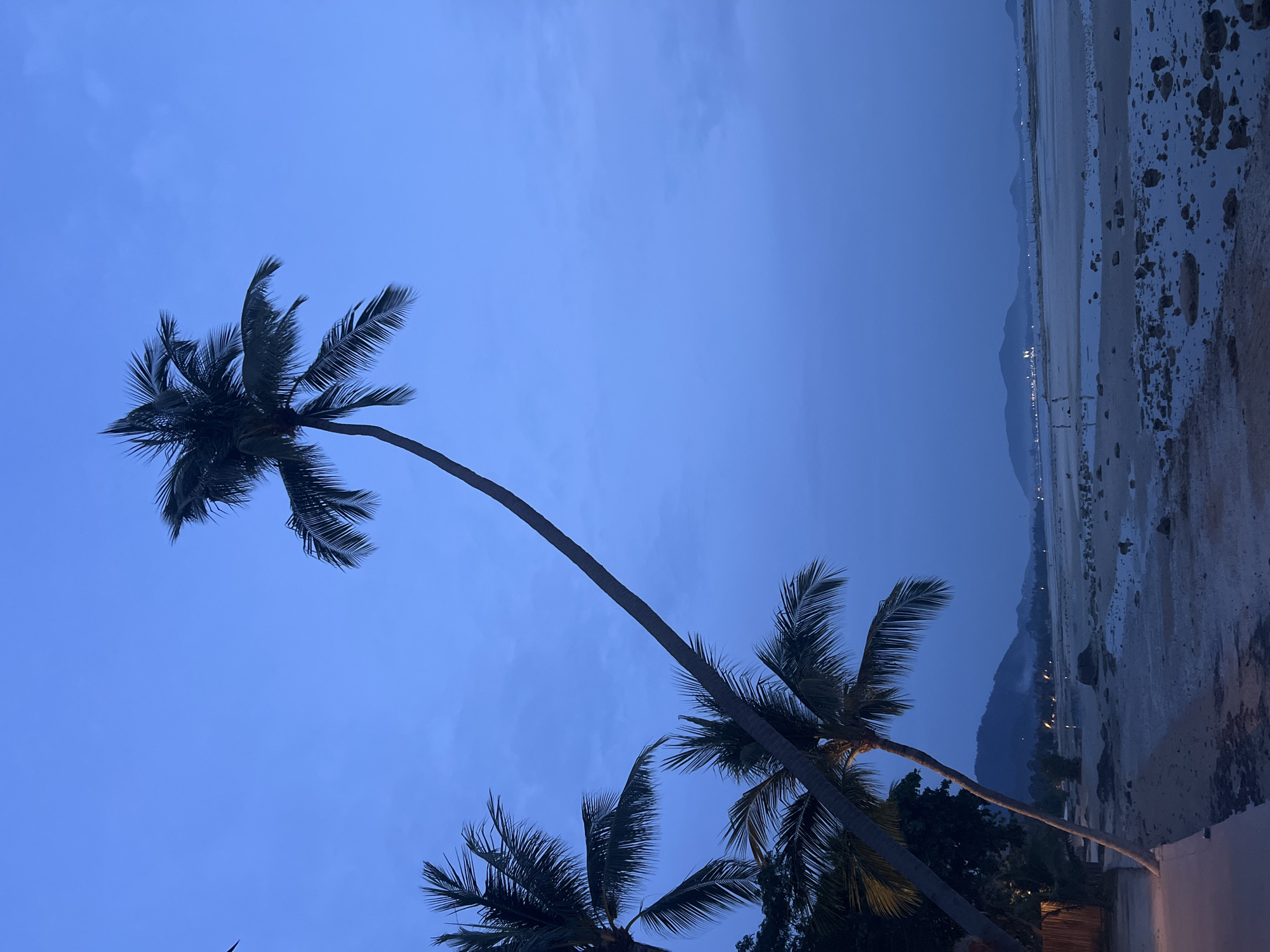 Evening poolside scene captured in coastal Baan Thong Po