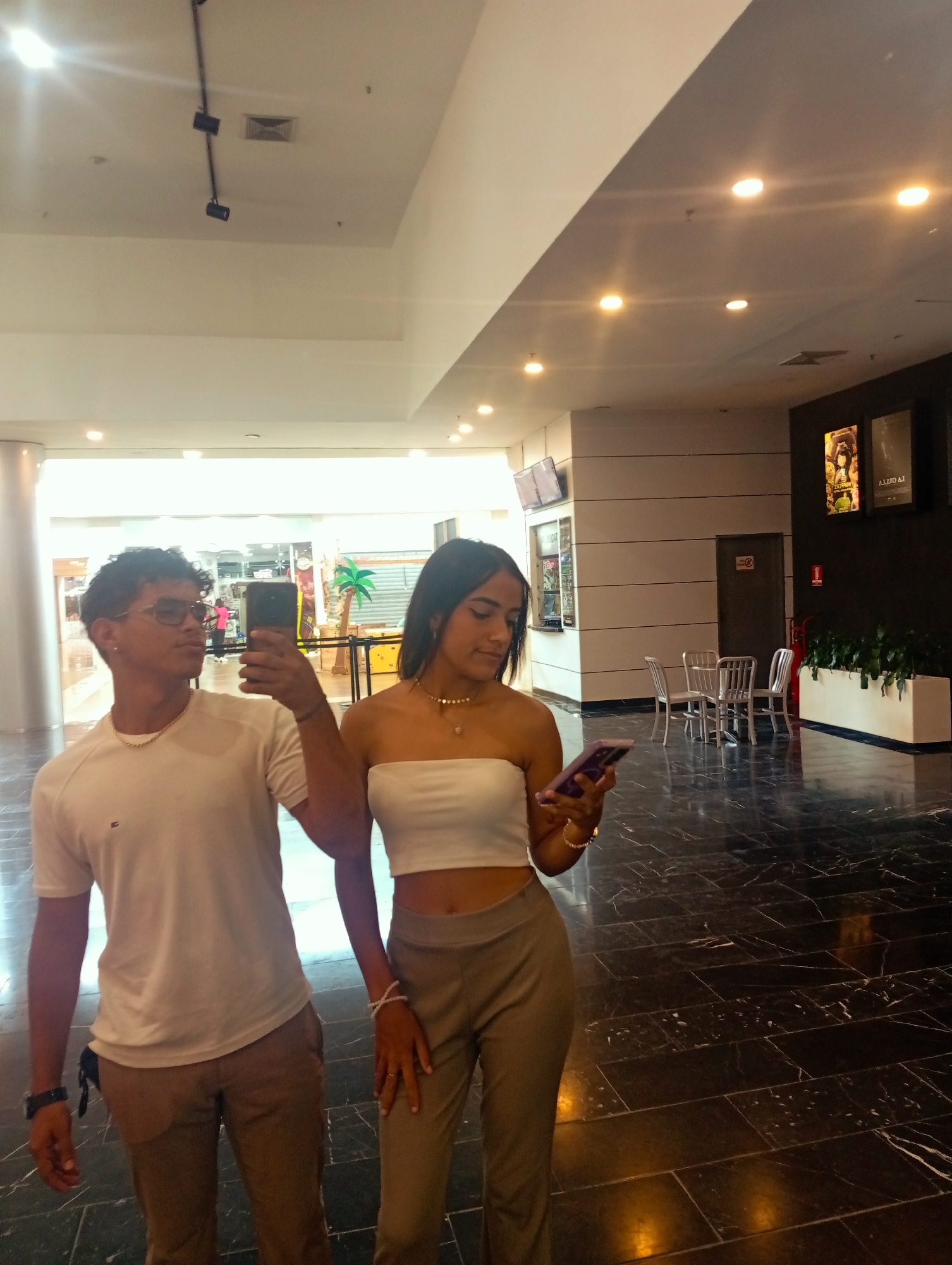 Young adults document casual mall visit in Pampatar, Venezuela
