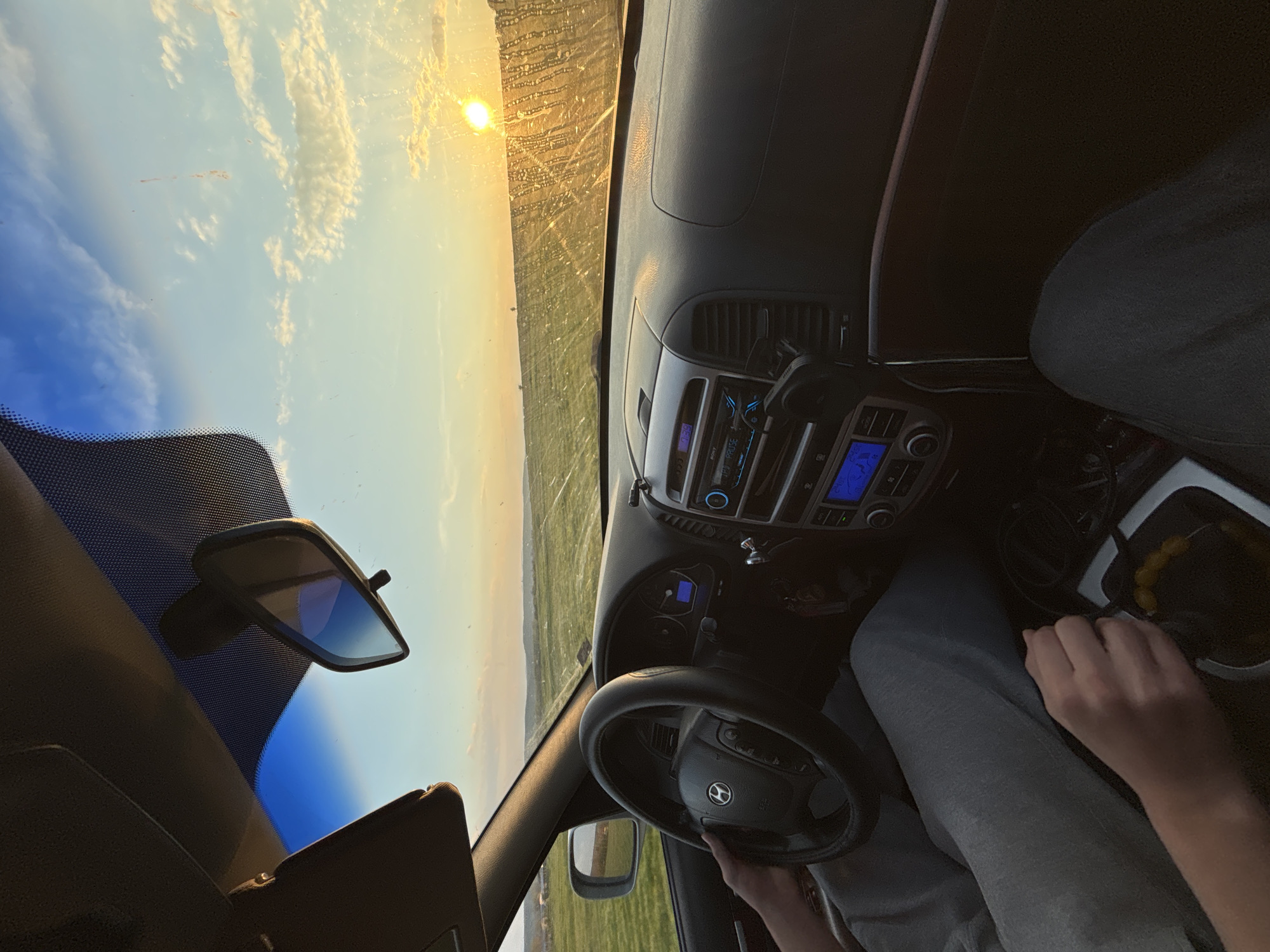 Driver travels rural Bulgaria roads at sunset near Lehchevo