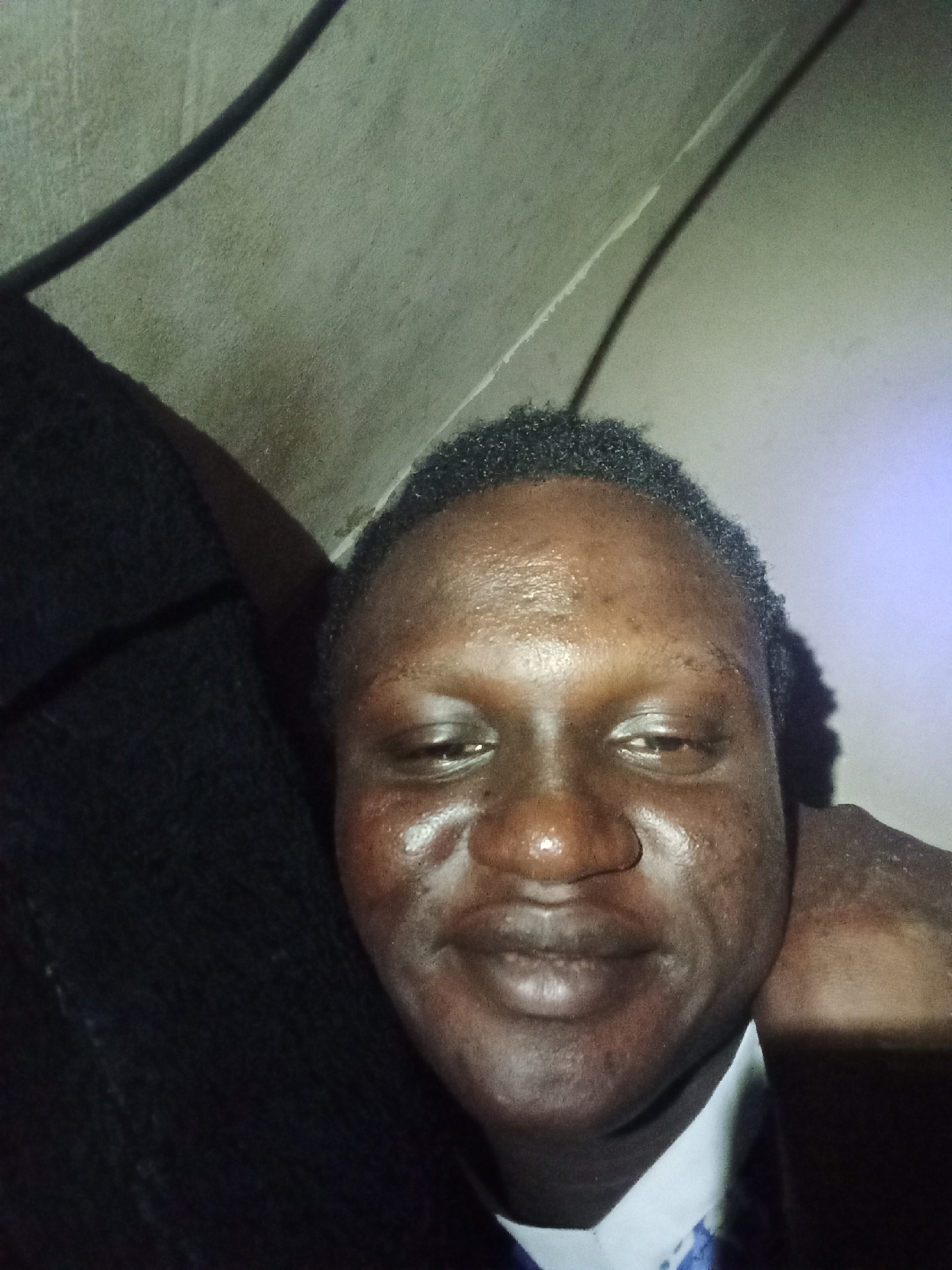 Person photographed in two indoor close-up shots within two minutes