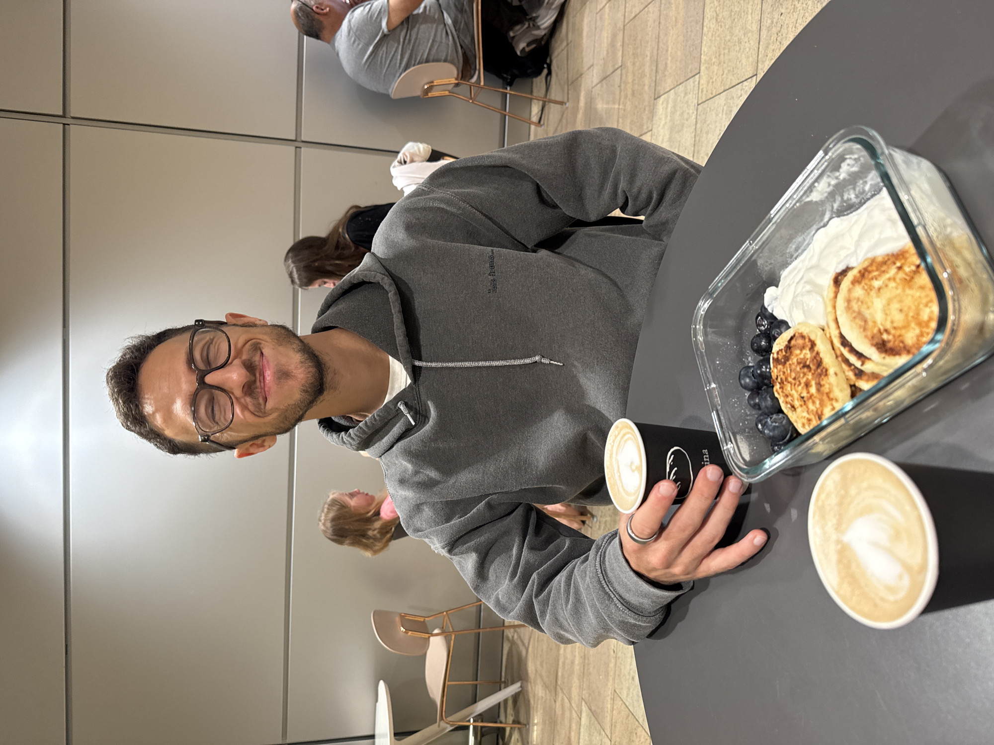 Breakfast shared at Israeli cafe during early morning hours