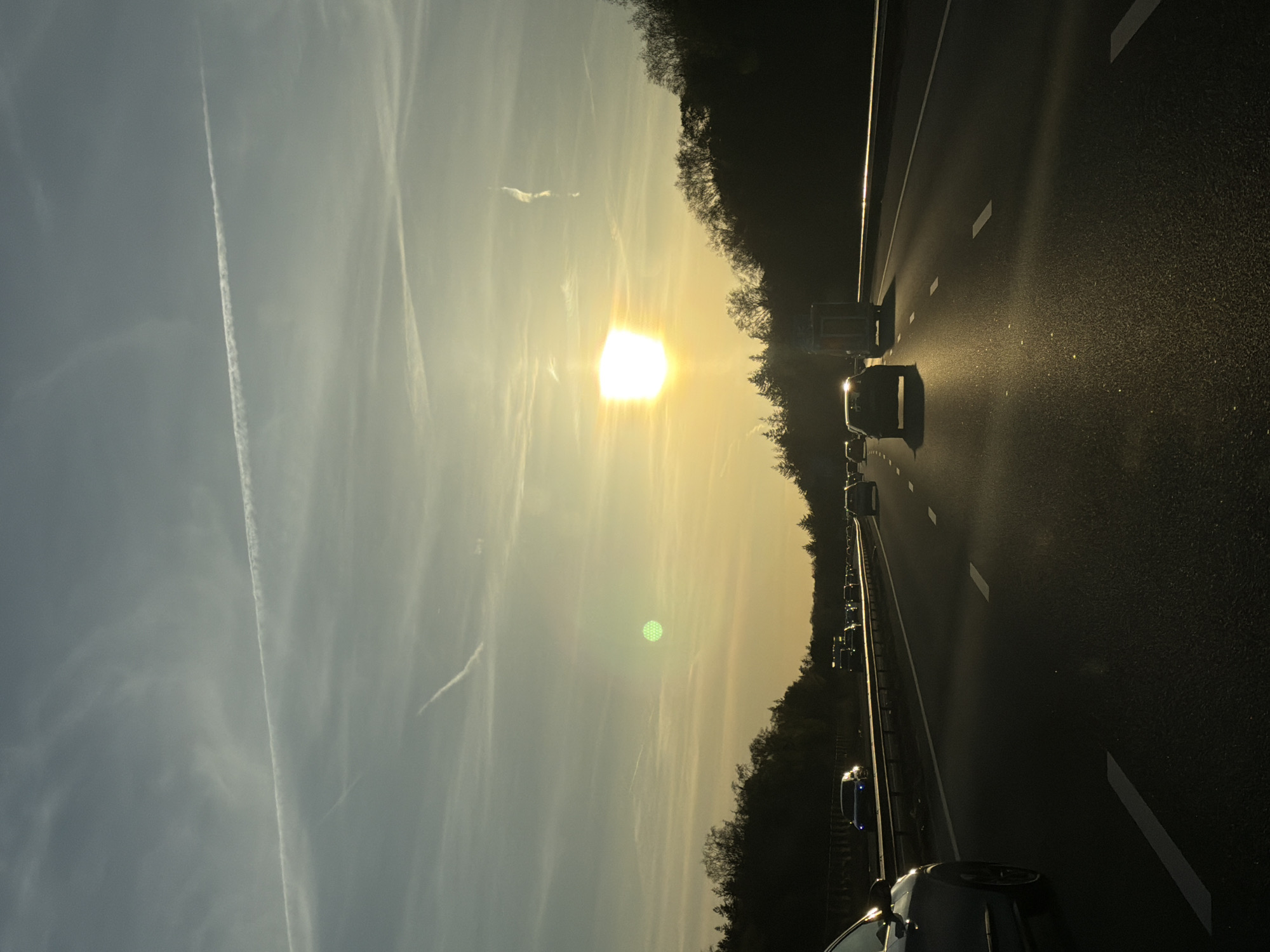 Evening traffic flows on Arnhem highway during sunset