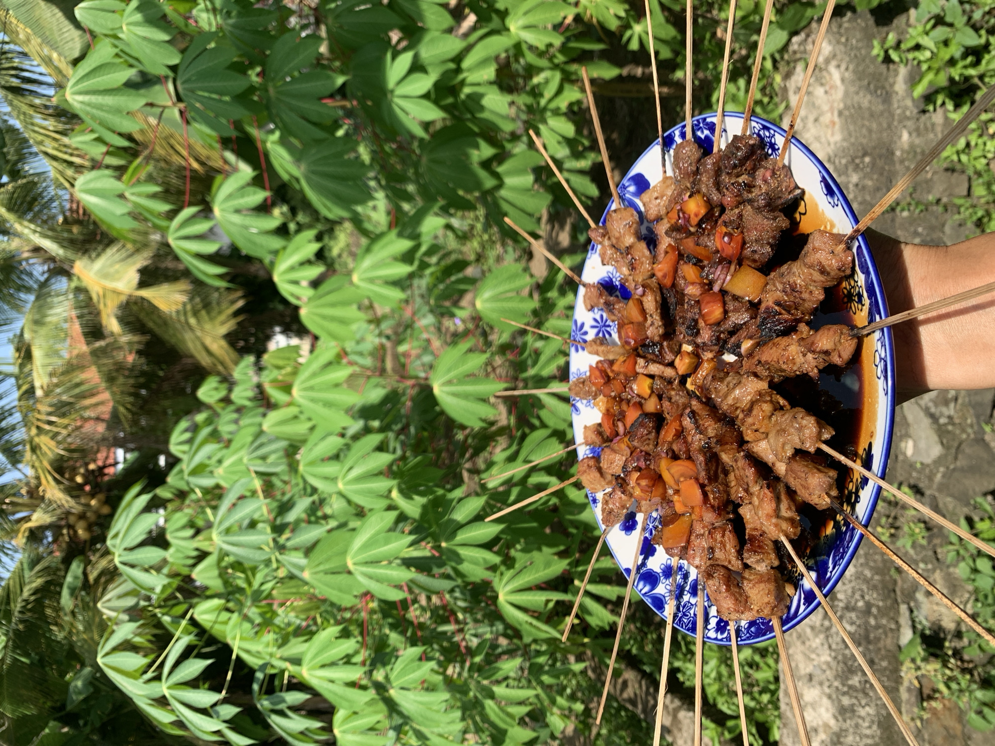 Early morning satay preparation documented in Karangkemiri, Indonesia