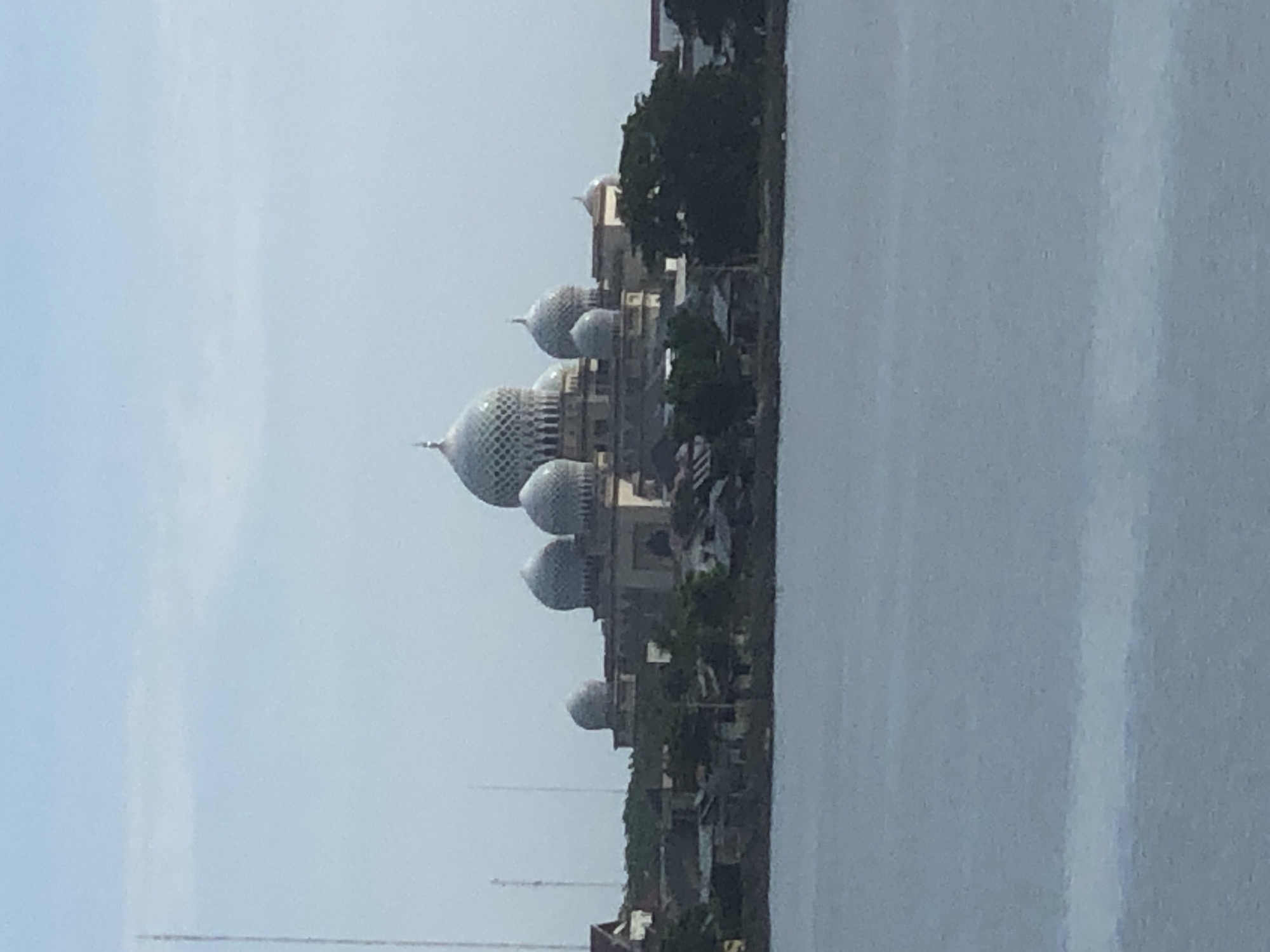 Early morning scenes captured around Lhokseumawe mosque and waterway