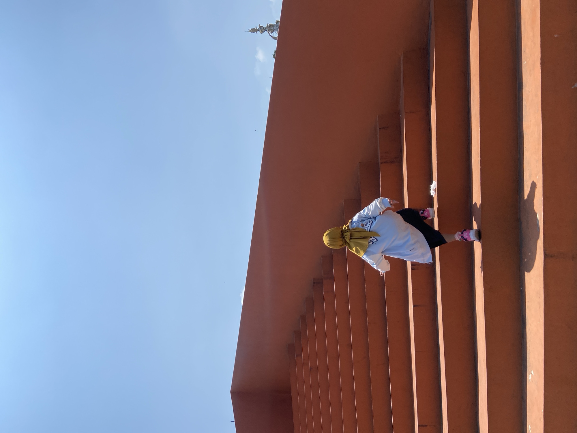 Person in yellow hijab visits public recreational space in Sidoarjo