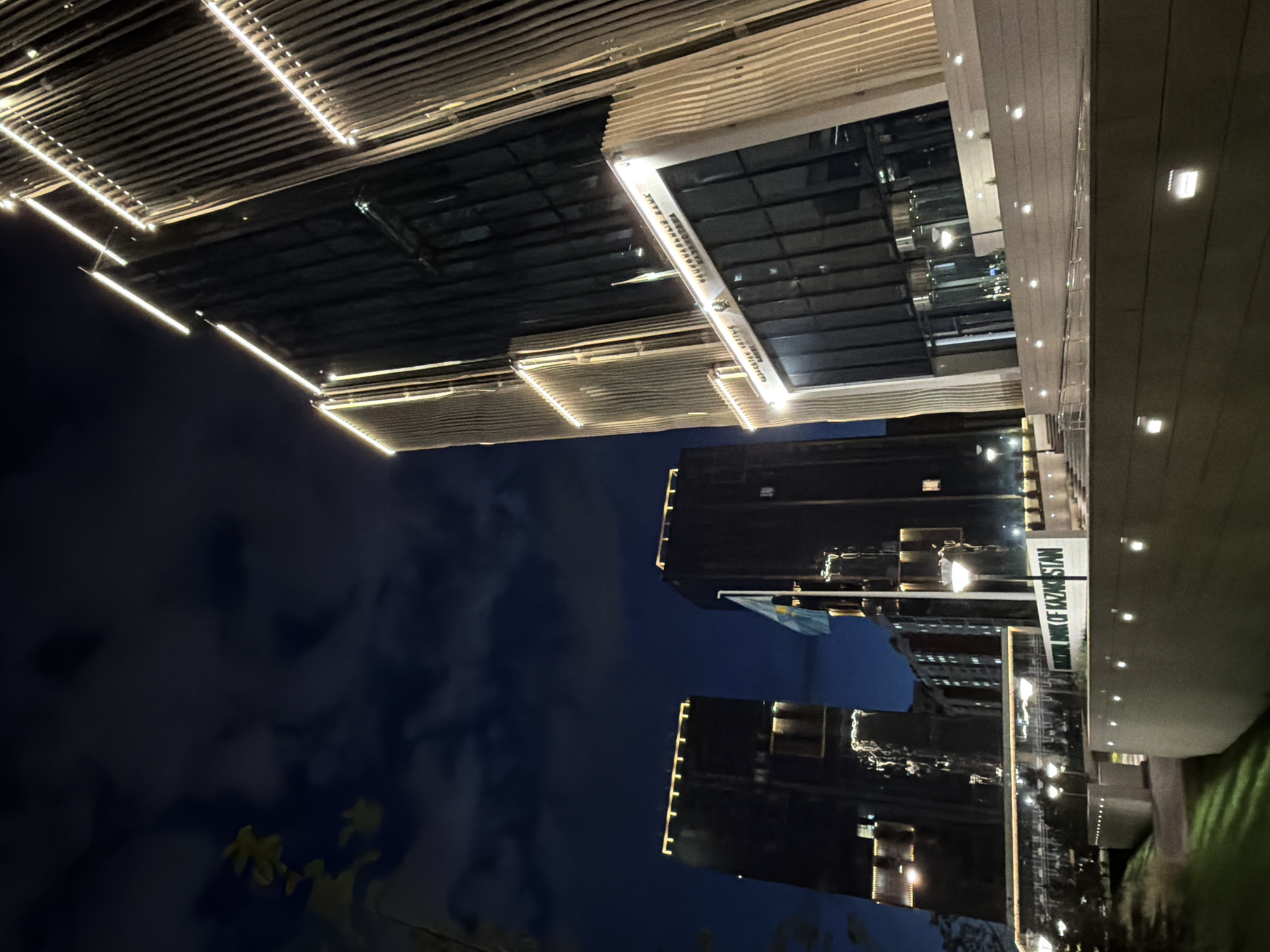 Night drive through Astana's lit streets and landmarks