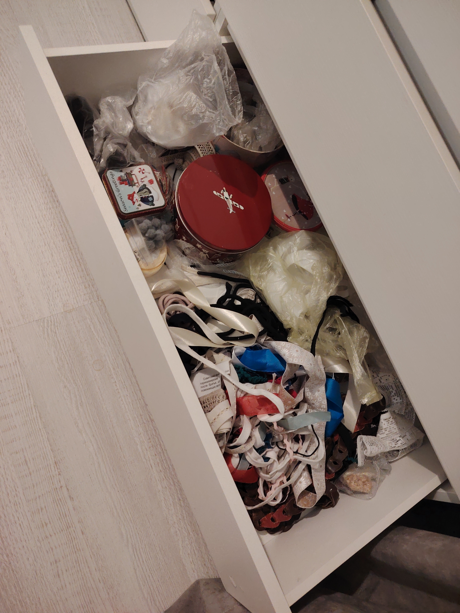 Collector documents vintage dolls and craft supplies in Belarus home