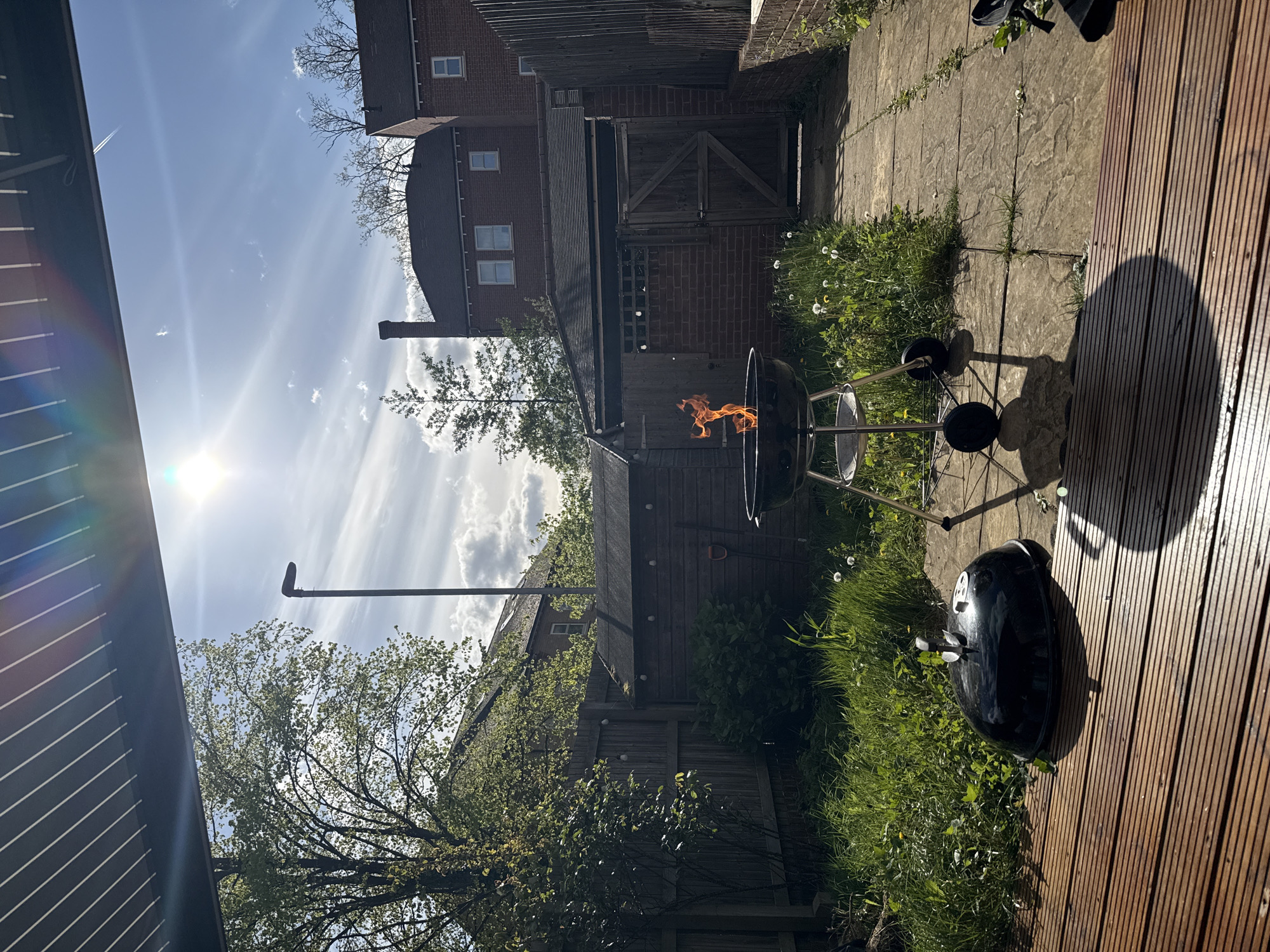 Barbecue grills burning in London garden on sunny afternoon