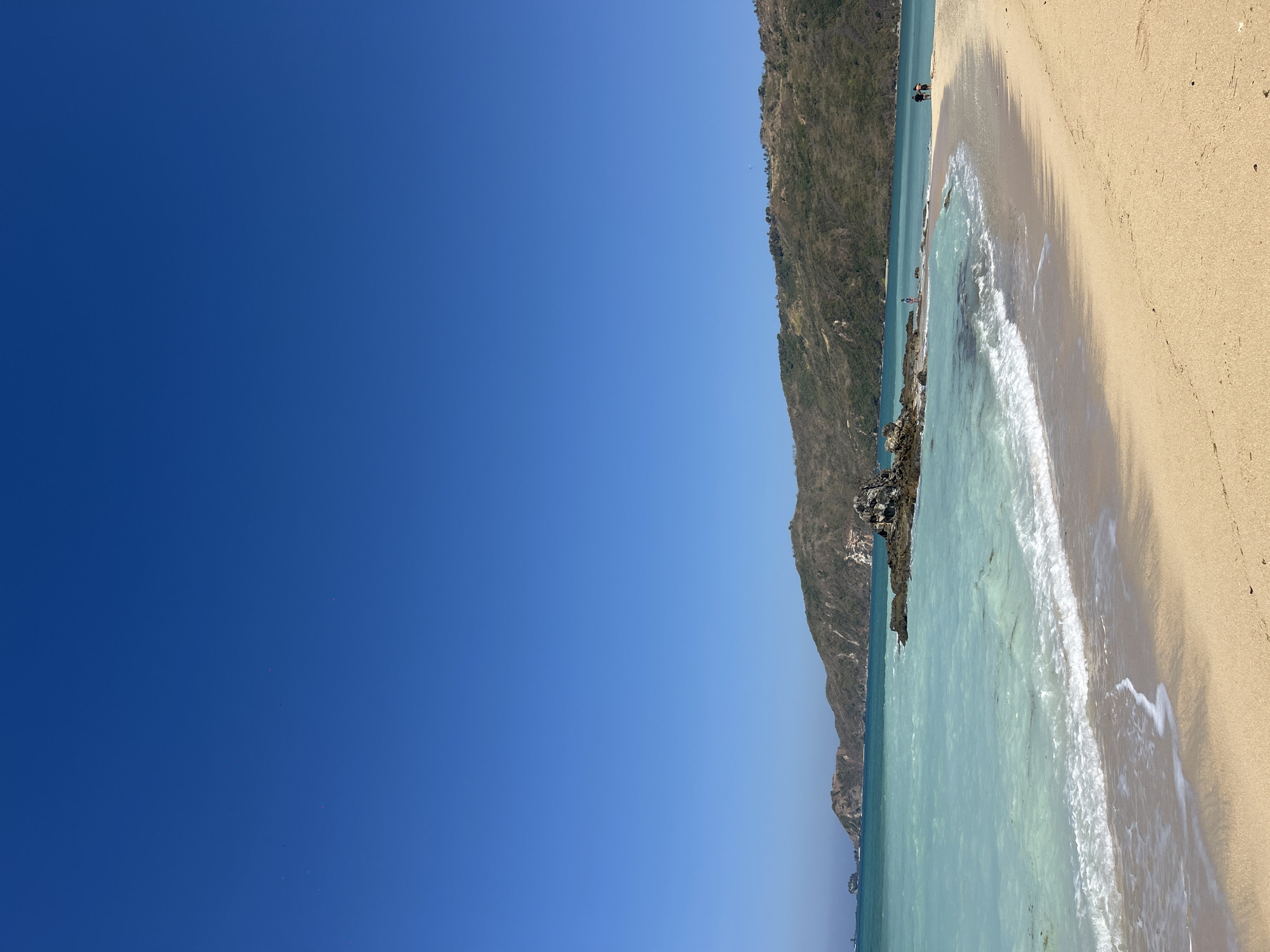 Kuta Beach, Lombok — shoreline and beachfront walkway on a clear day