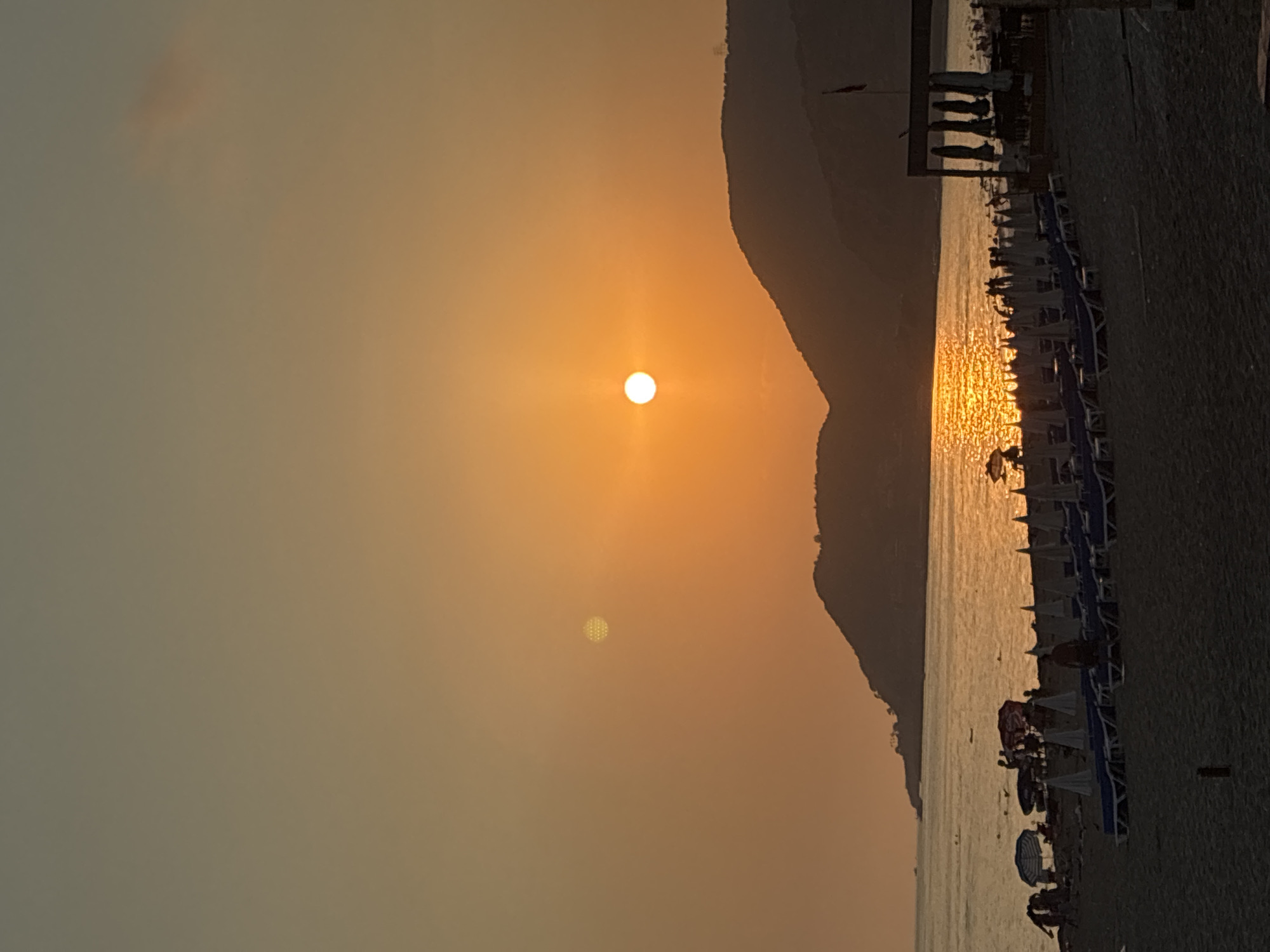 Alanya beach at sunset: crowds, cats, and golden light