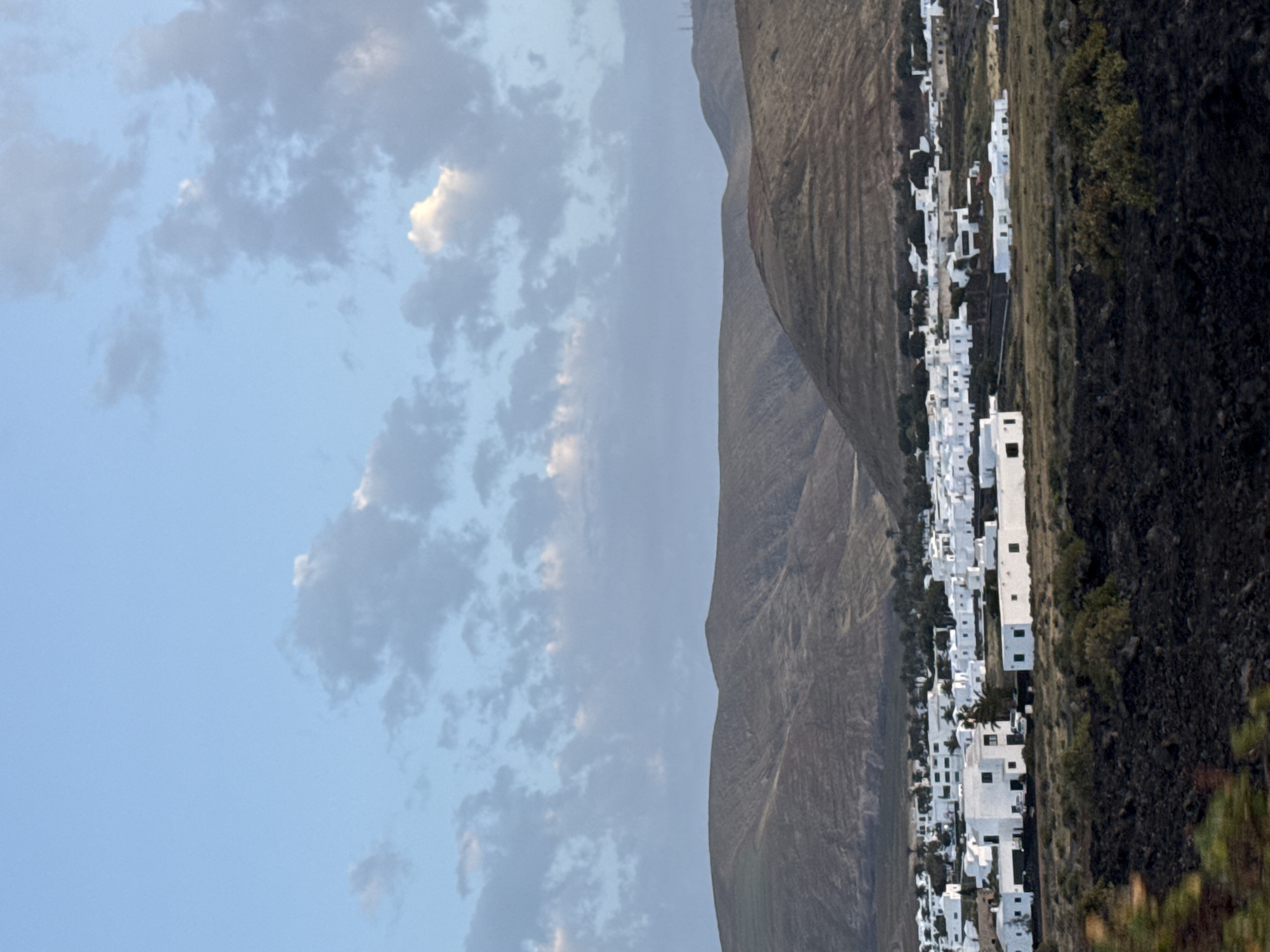 Village scene captured in Yaiza, Spain under cloudy skies