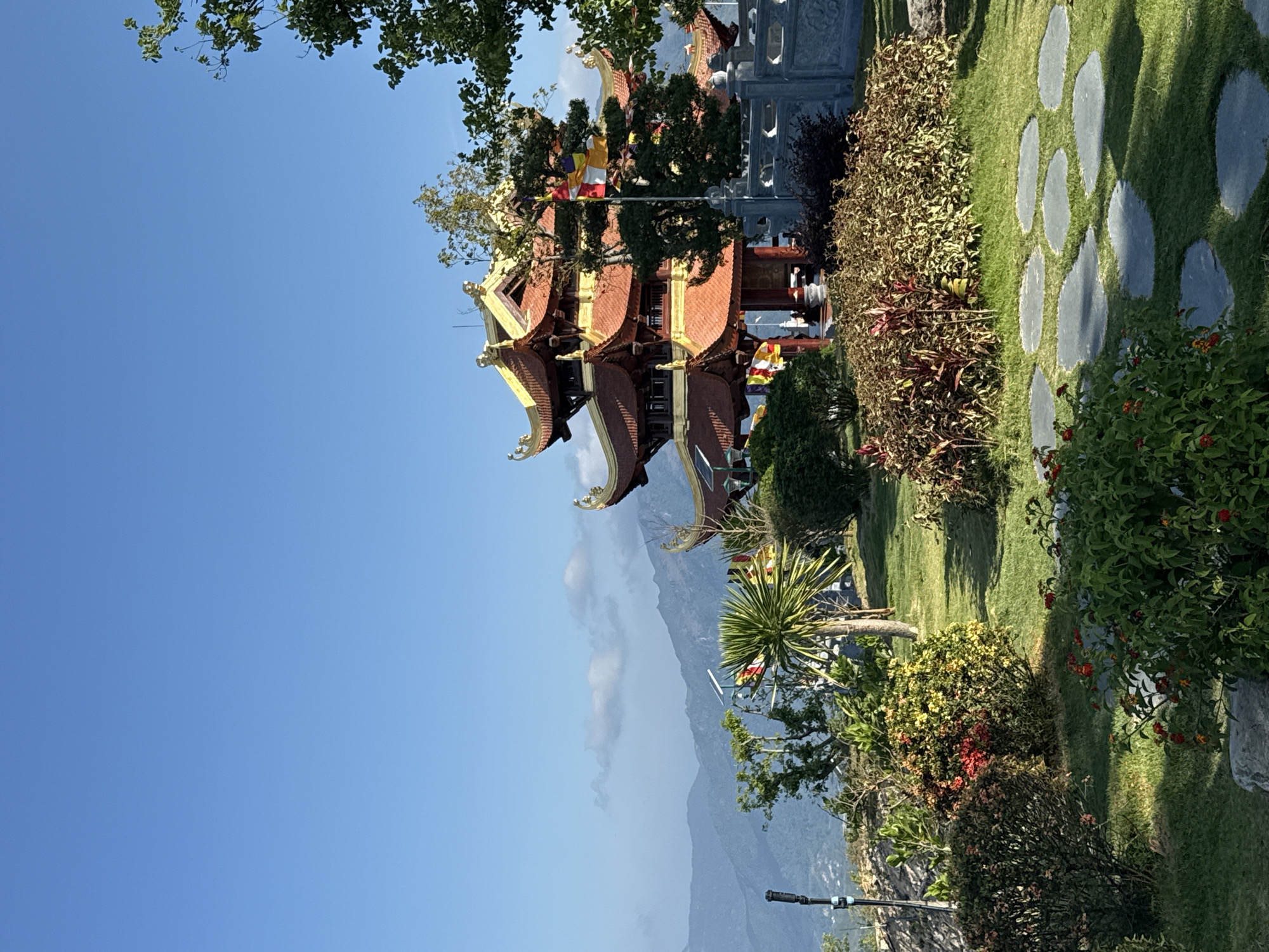 Visitor documents traditional pagoda and Buddha statue in Nha Trang
