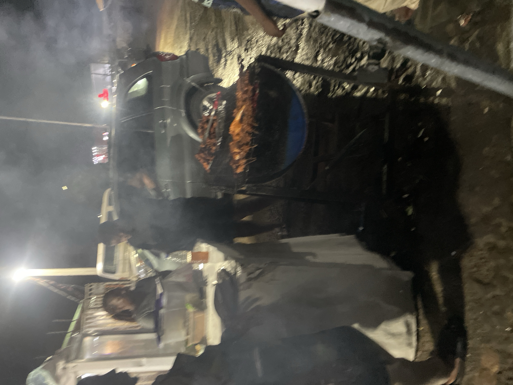 Late-night suya stop at a street grill in Abuja