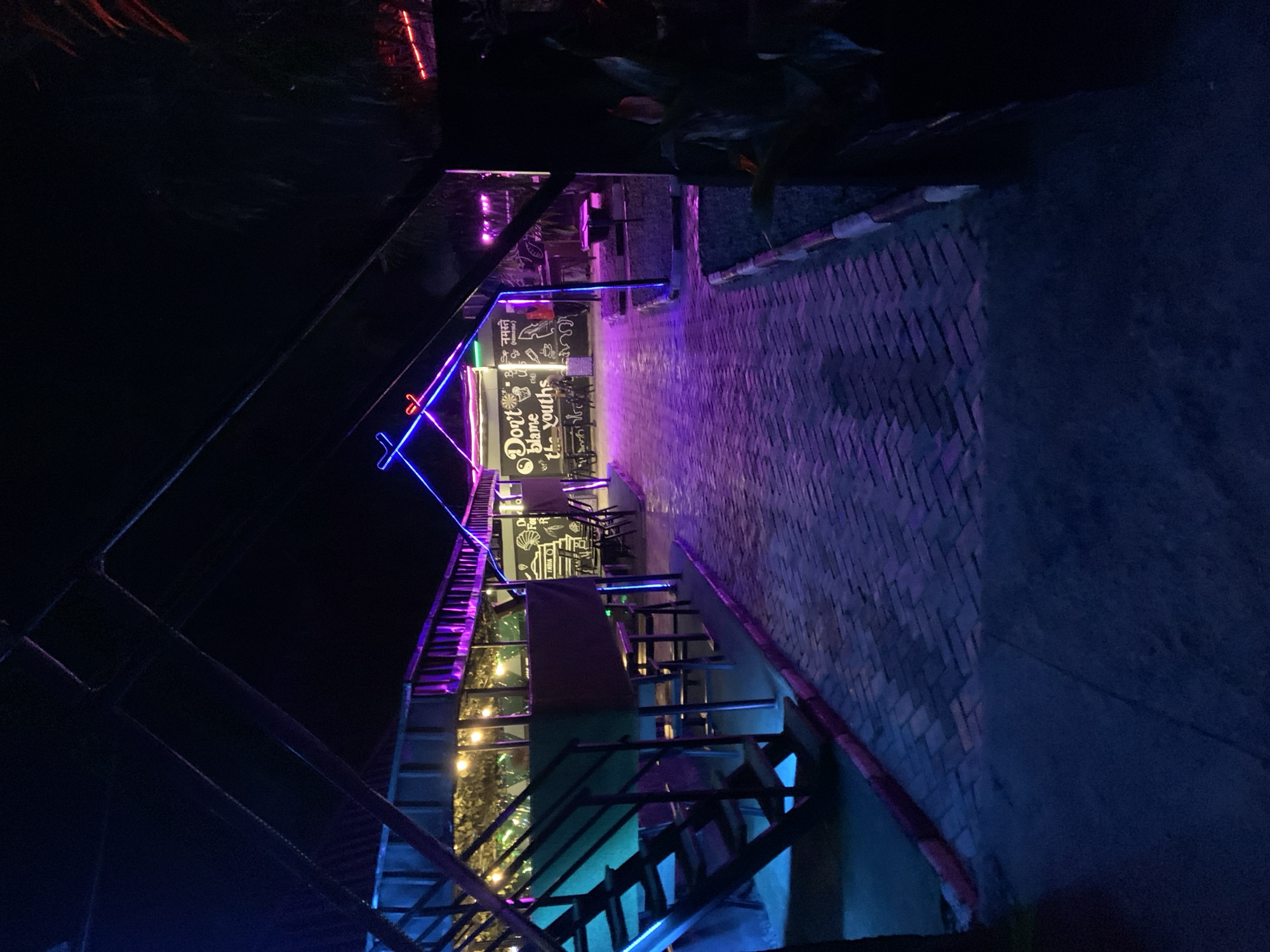 Neon-lit outdoor restaurant documented in Gura Top, Nigeria