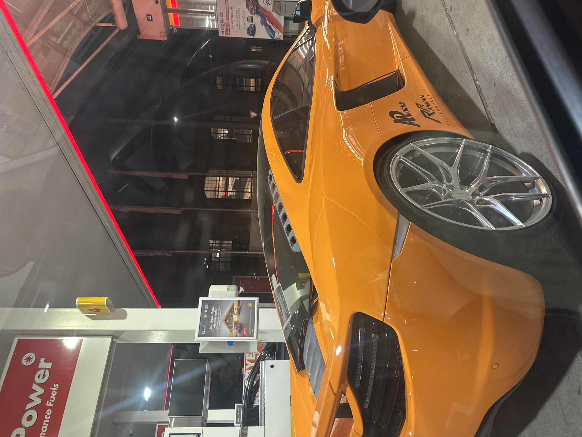 Orange McLaren spotted at Shell station in Winterthur