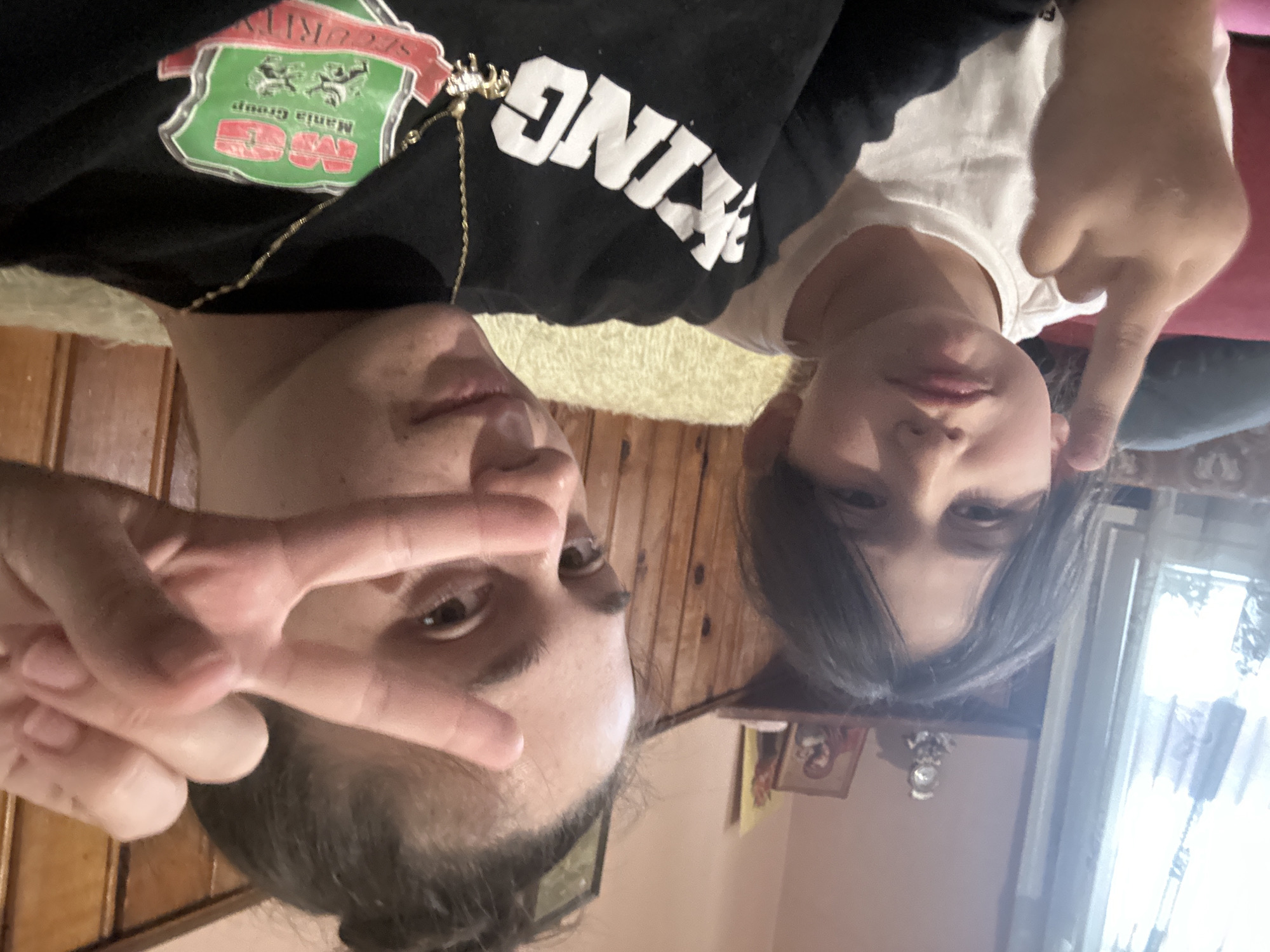 Adult and child take playful selfies in Resen, Bulgaria