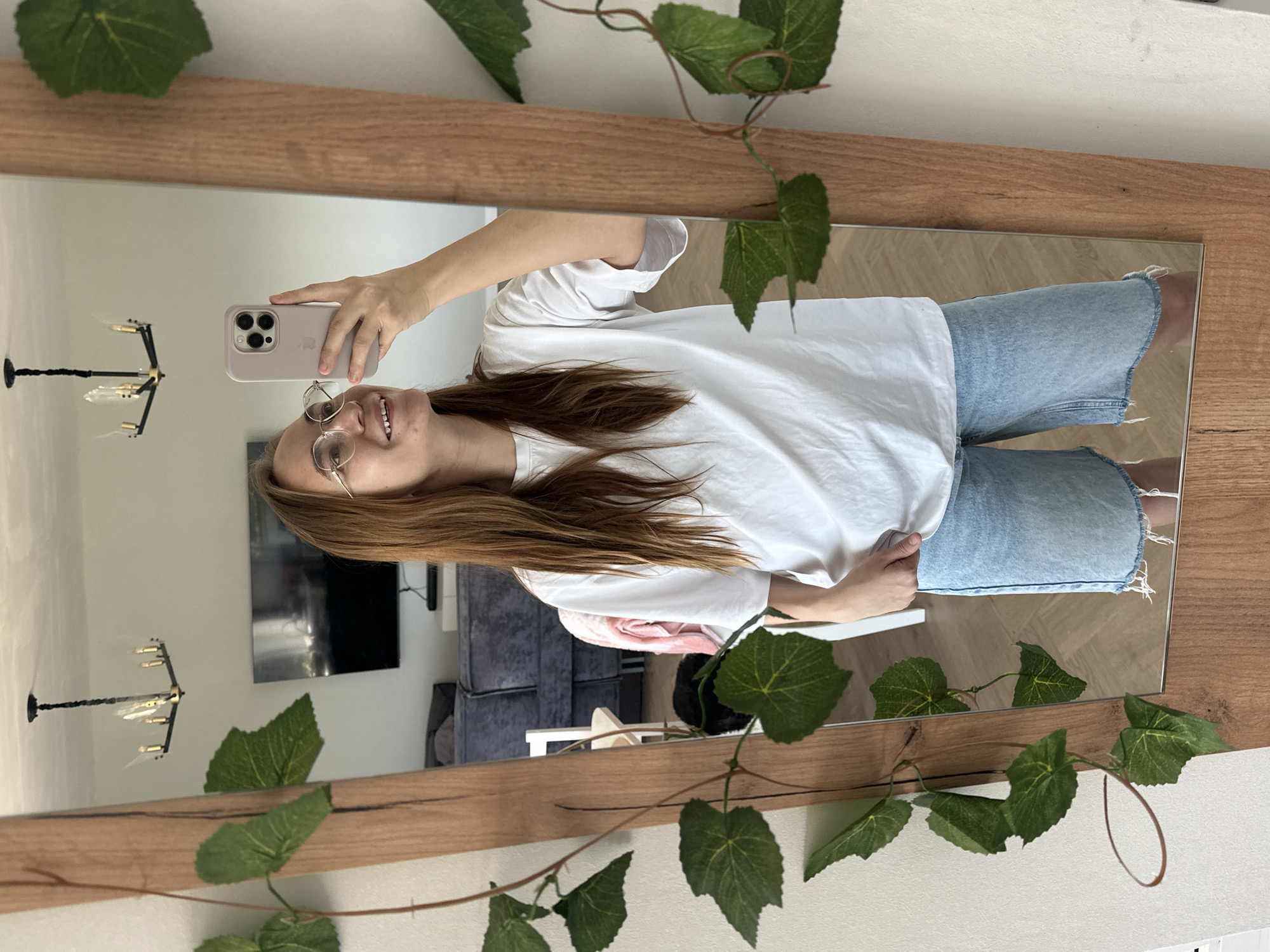 Woman takes mirror selfie in Kharnavy, Russia