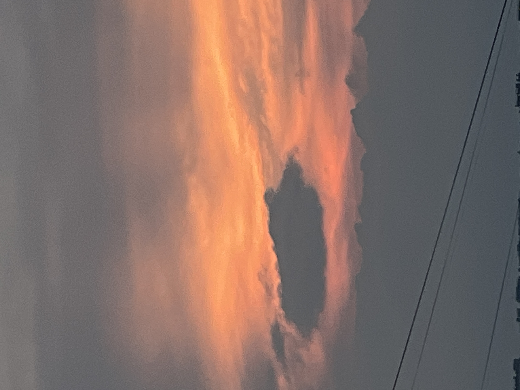 Sunset clouds over a Russian town, caught from multiple angles
