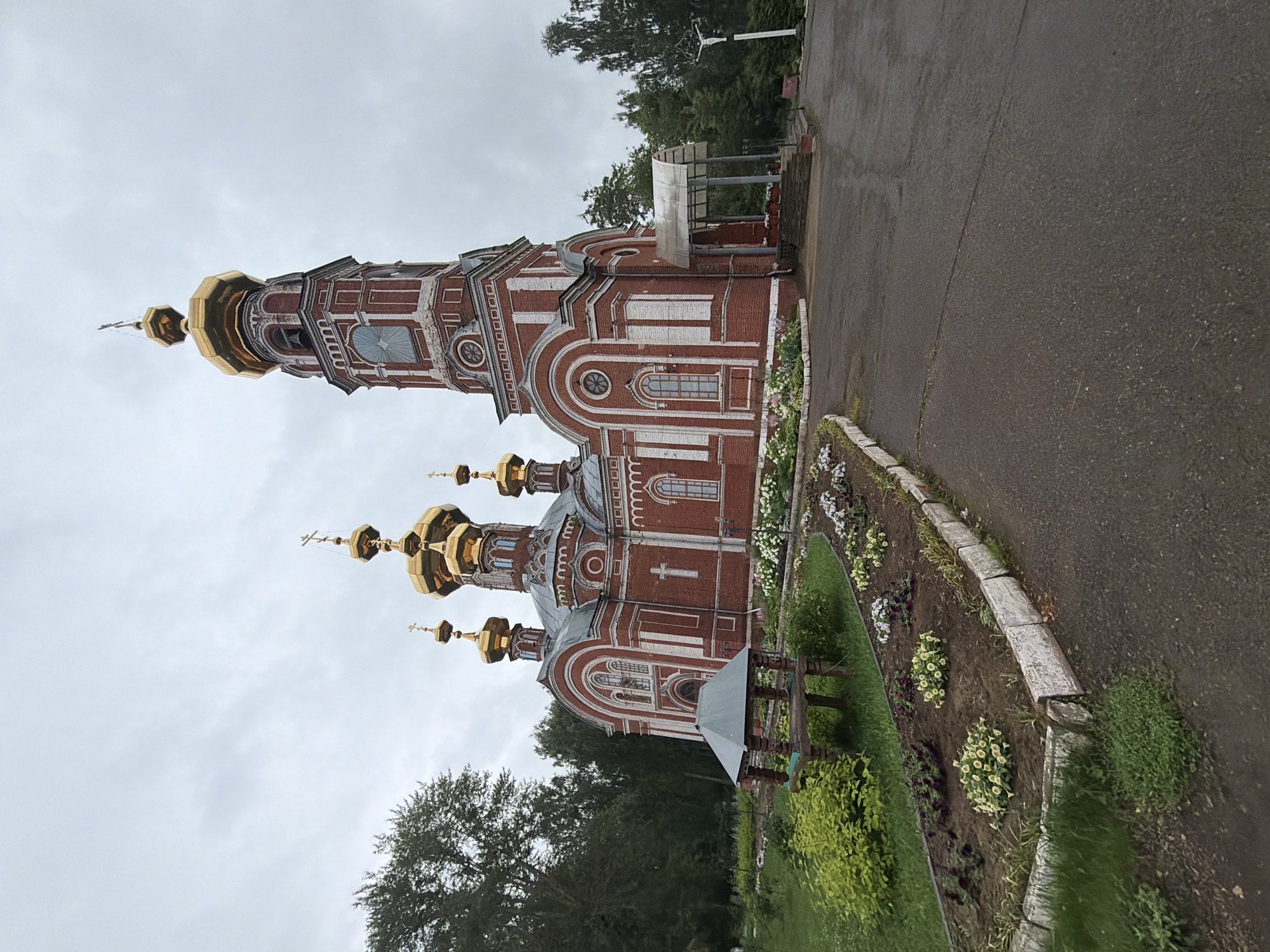 Orthodox church with golden domes in Osa, Russia