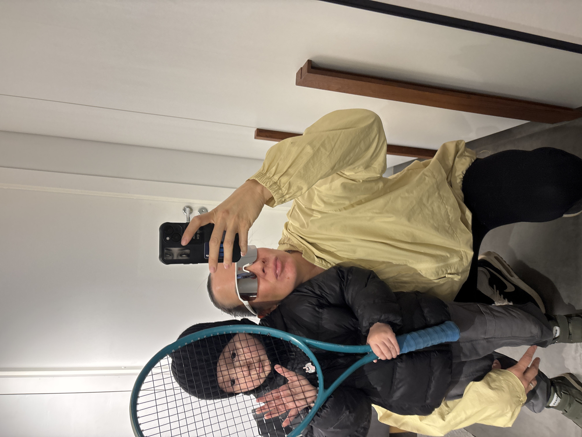 Adult and child photographed together indoors in Chaikovsky