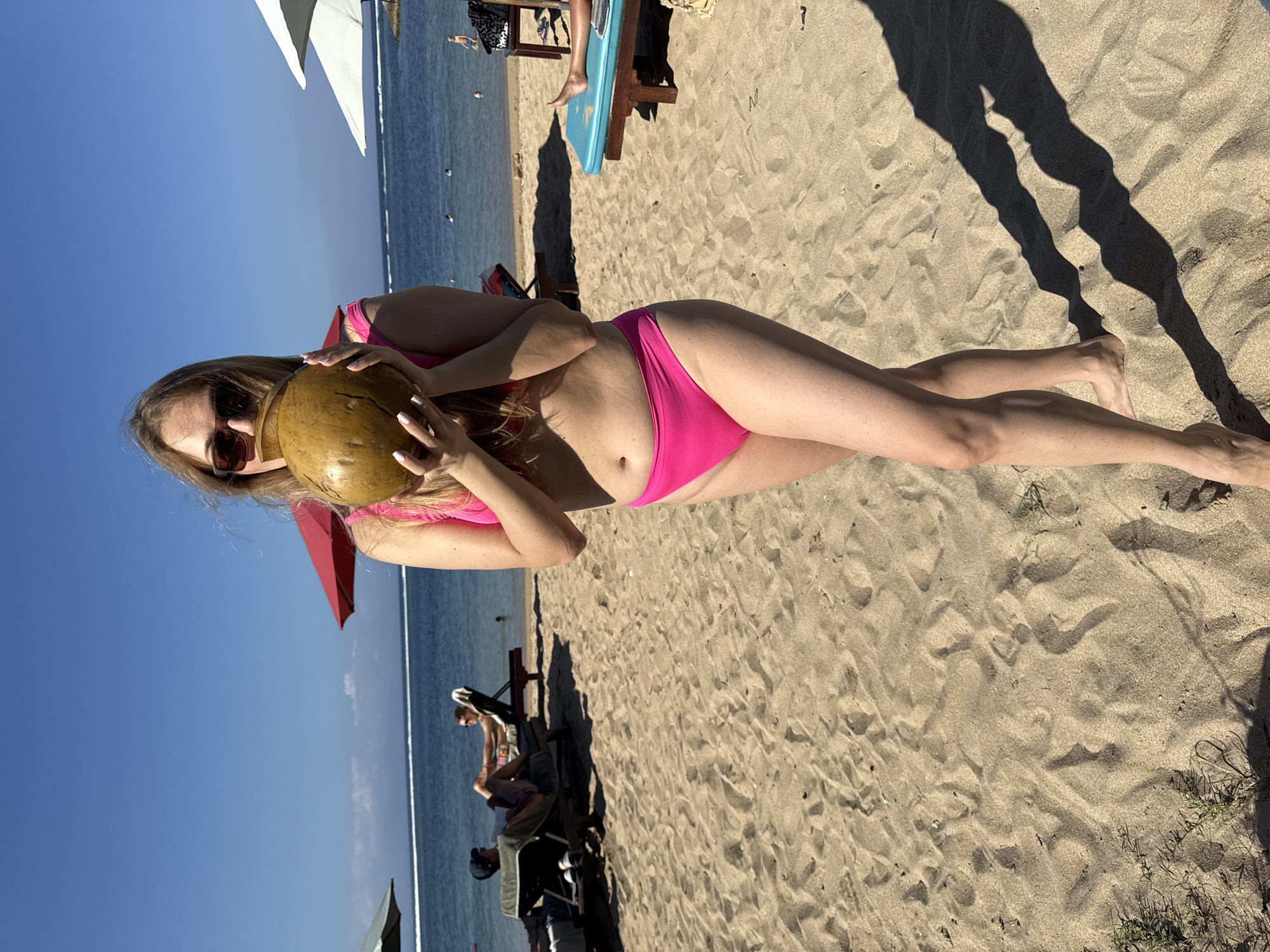 Coconut drink on a Bali beach, sunny morning