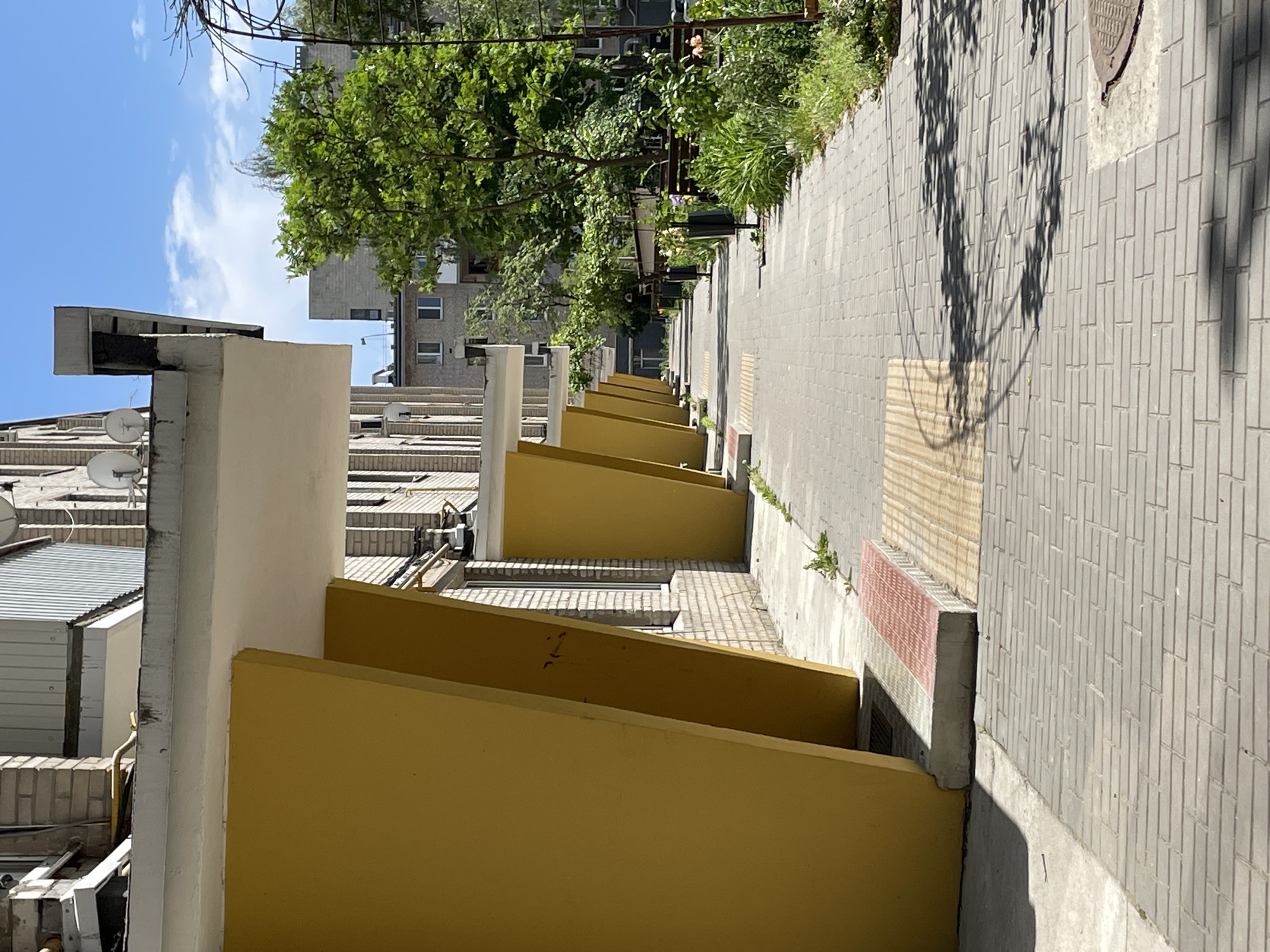 Building with yellow balconies documented in Brest, Belarus