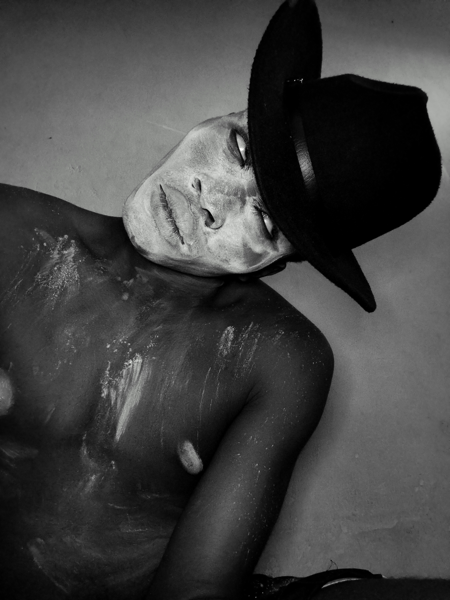 Black and white portraits playing with face concealment and anonymity