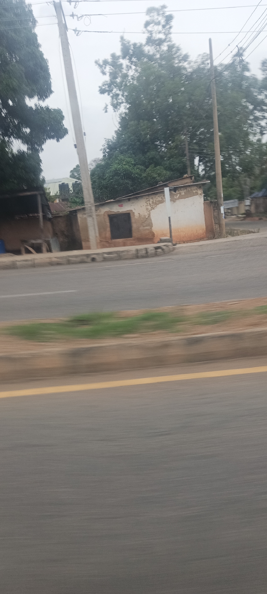 Vehicle journey documented through motion-blurred photos in Jos, Nigeria