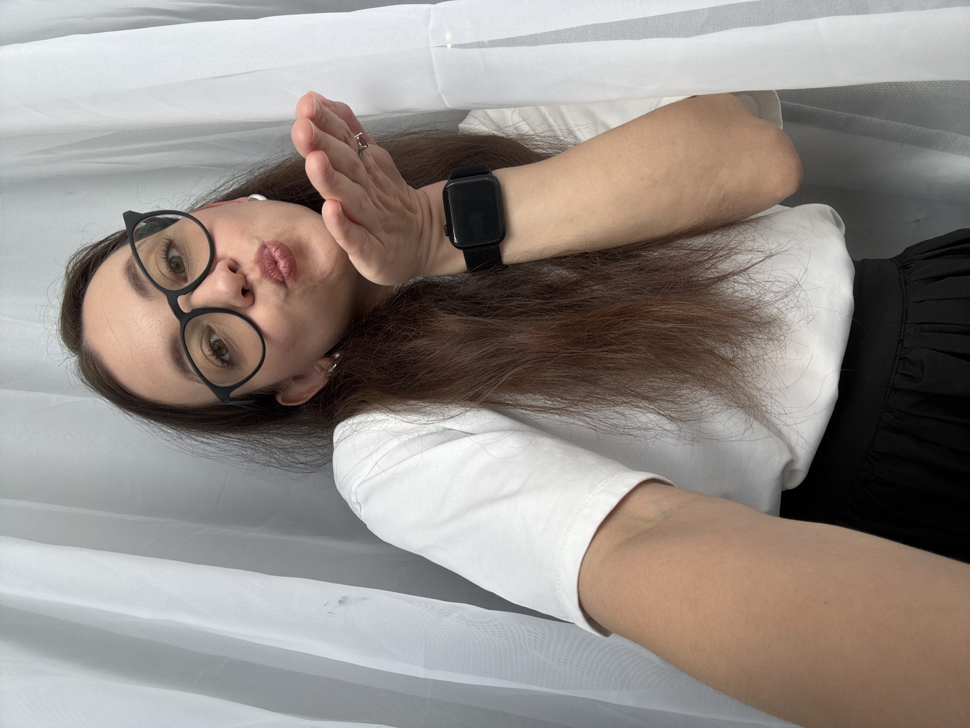 Woman takes selfies on floor in Nizhny Novgorod
