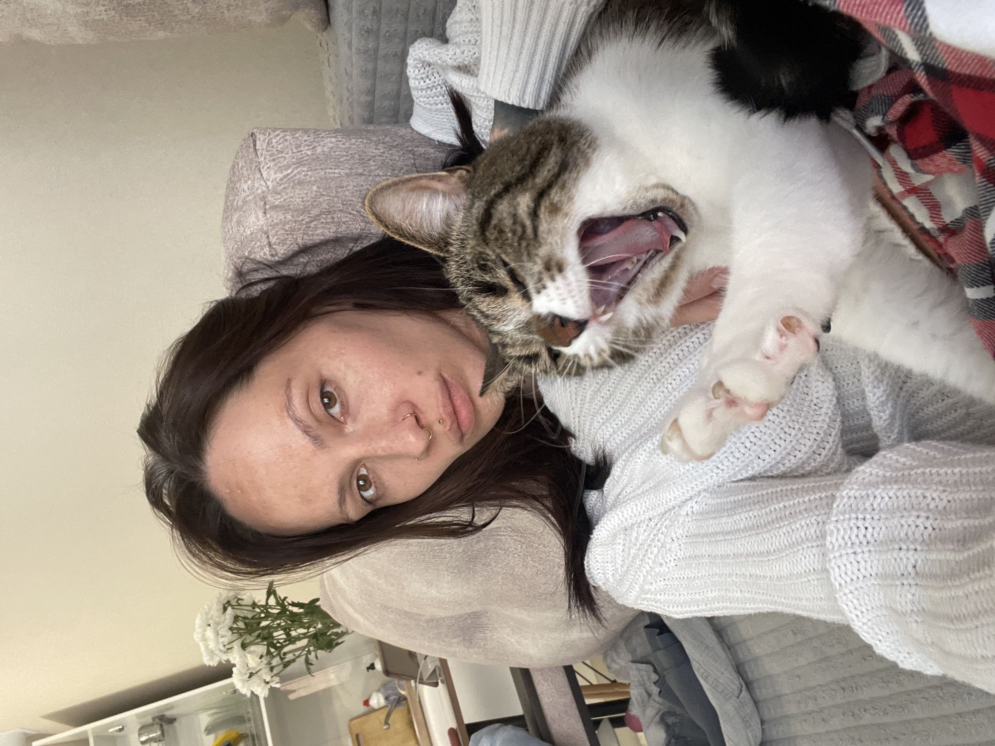 Woman and cat photographed together in Izhevsk home