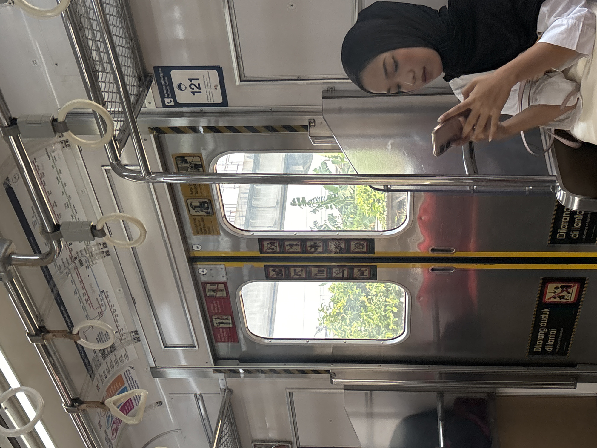 Morning commute captured on Jakarta train car June 9