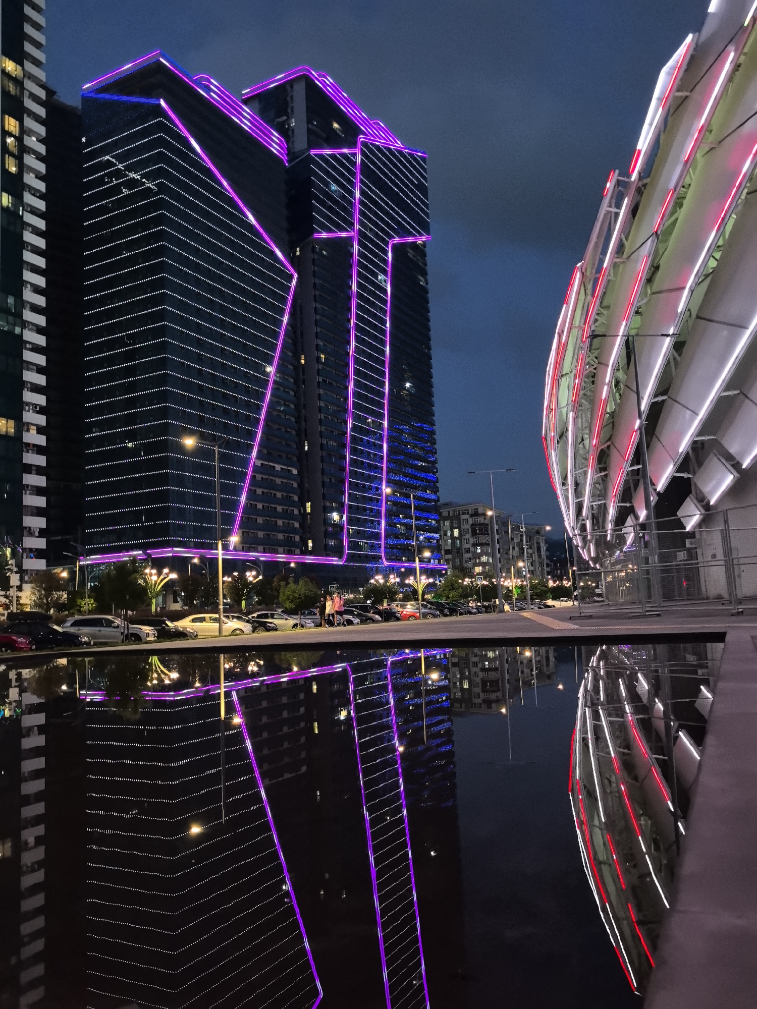 Batumi's neon-lit waterfront skyline at dusk