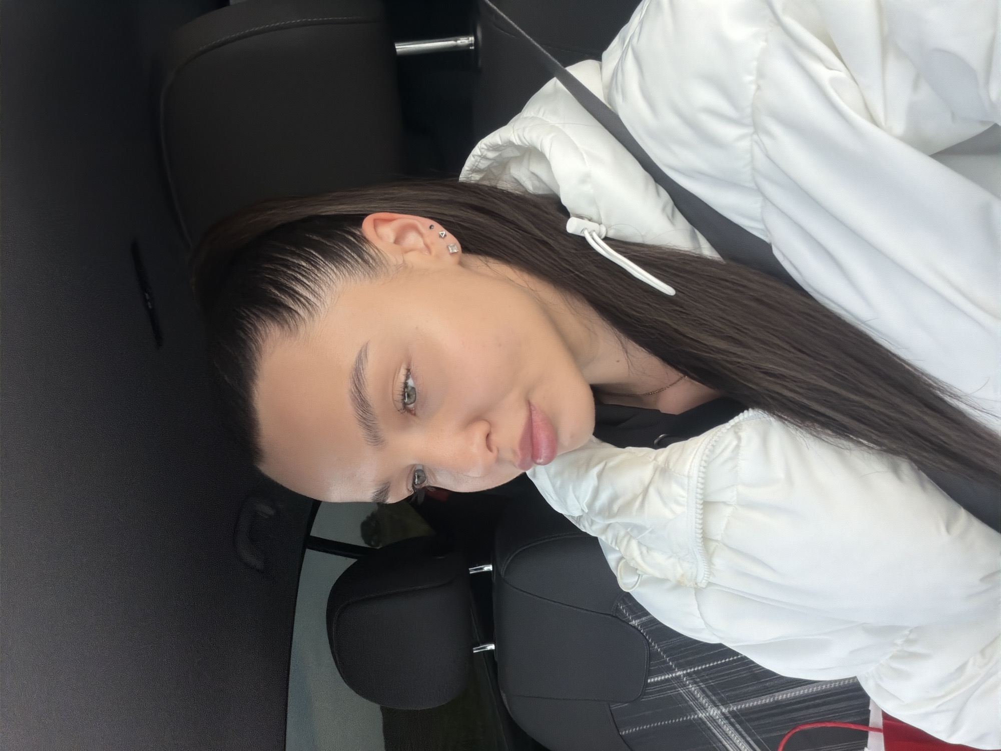 Woman photographed in car interior, Sofia, early morning