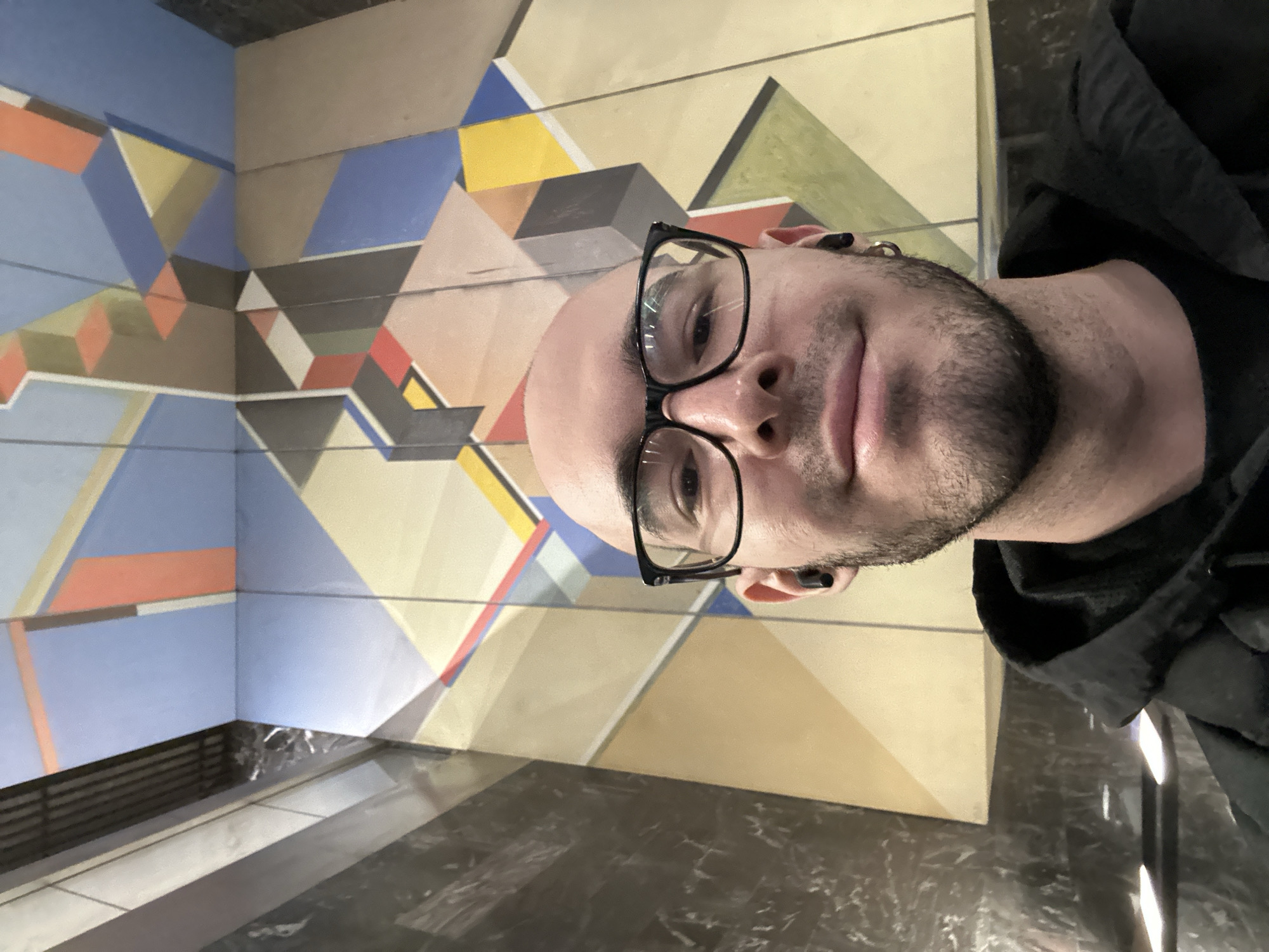 Man photographed against geometric wall in Khimki, Russia