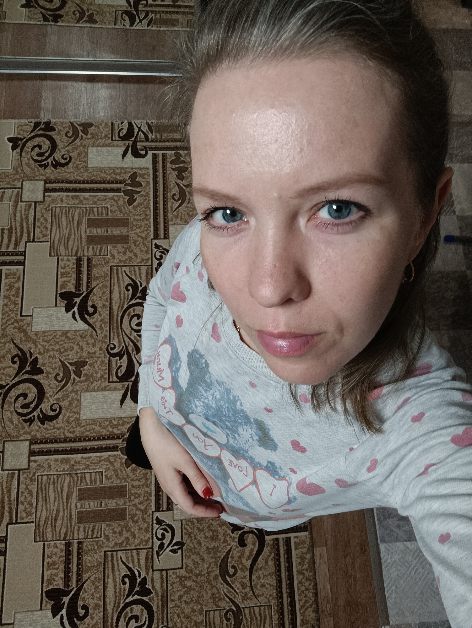 Woman photographed in Chaikovsky wearing heart-patterned shirt