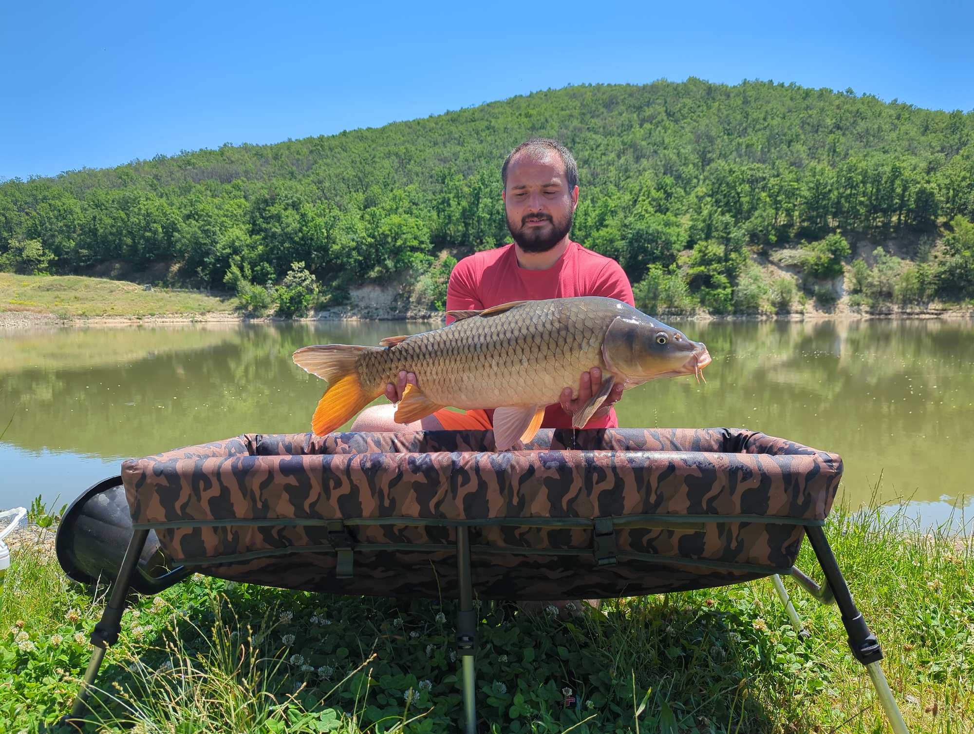 Angler catches large carp at Bulgarian lake
