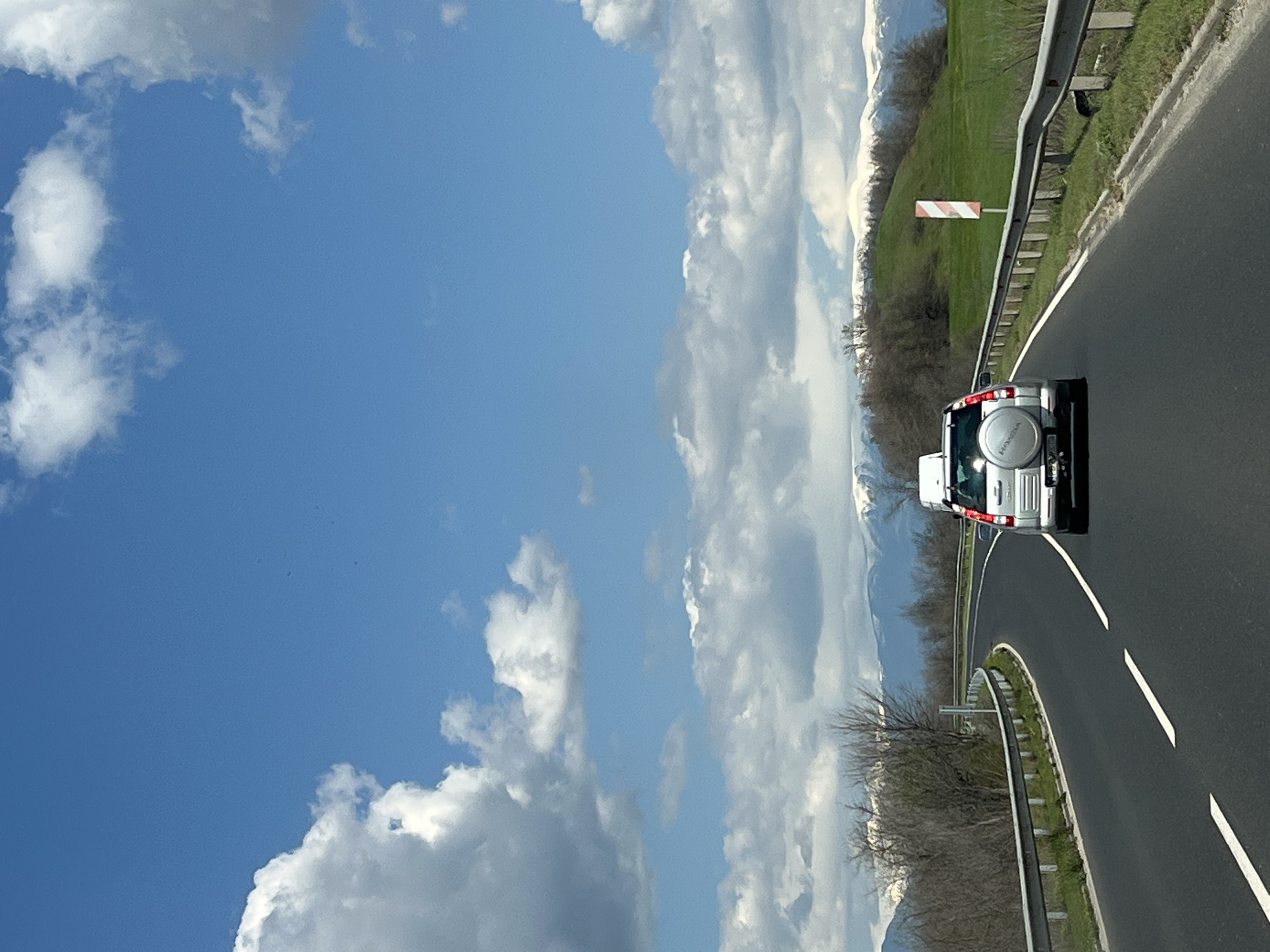 Silver car travels mountain road in Bulgaria