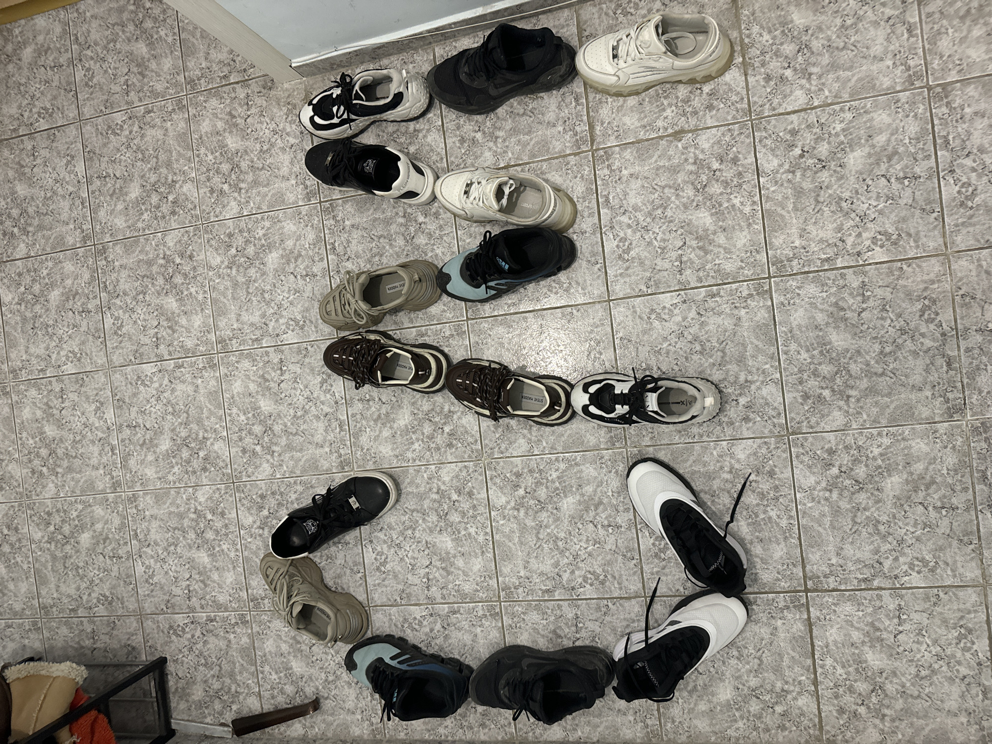 Person arranges shoes in patterns, requests sneaker money in Varna