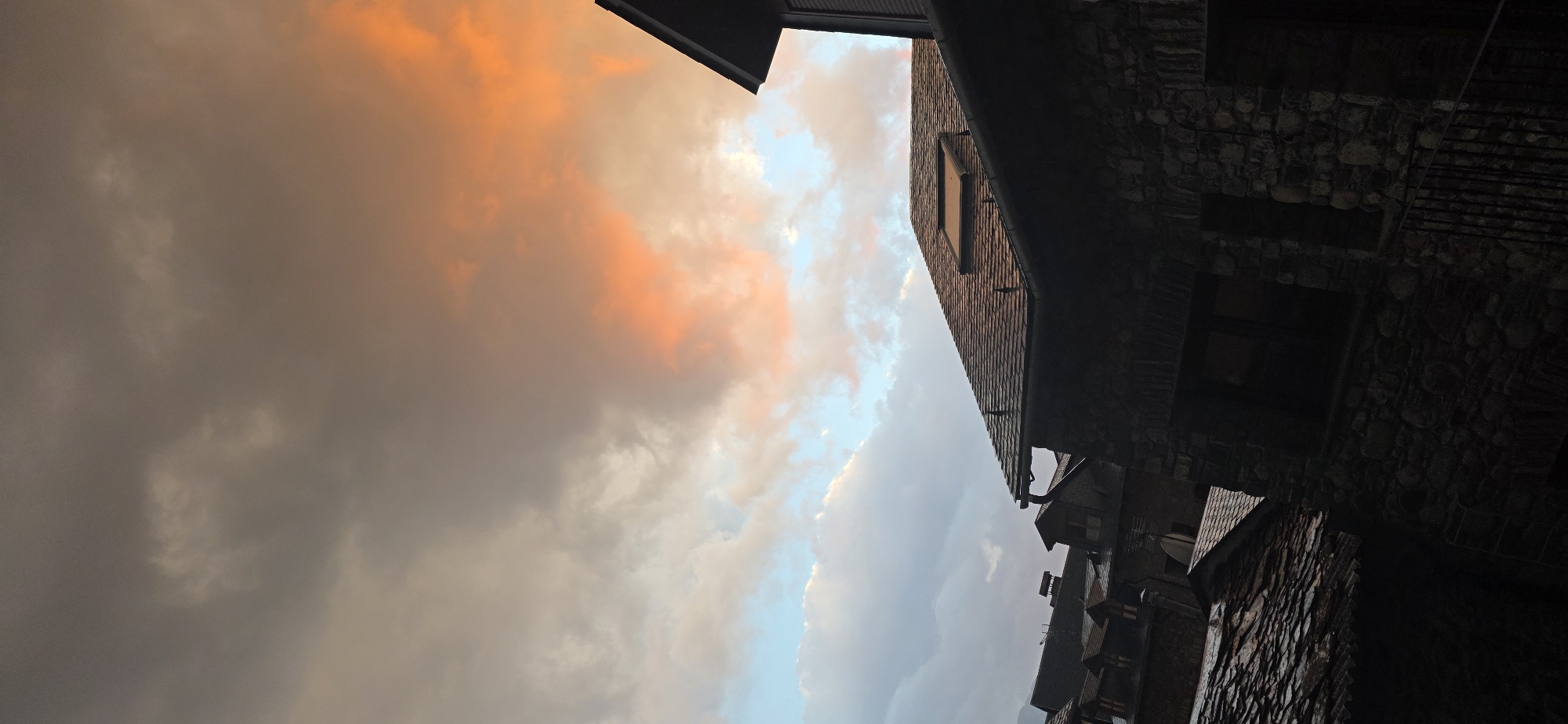 Dramatic sunset illuminates mountain town of Benasque, Spain
