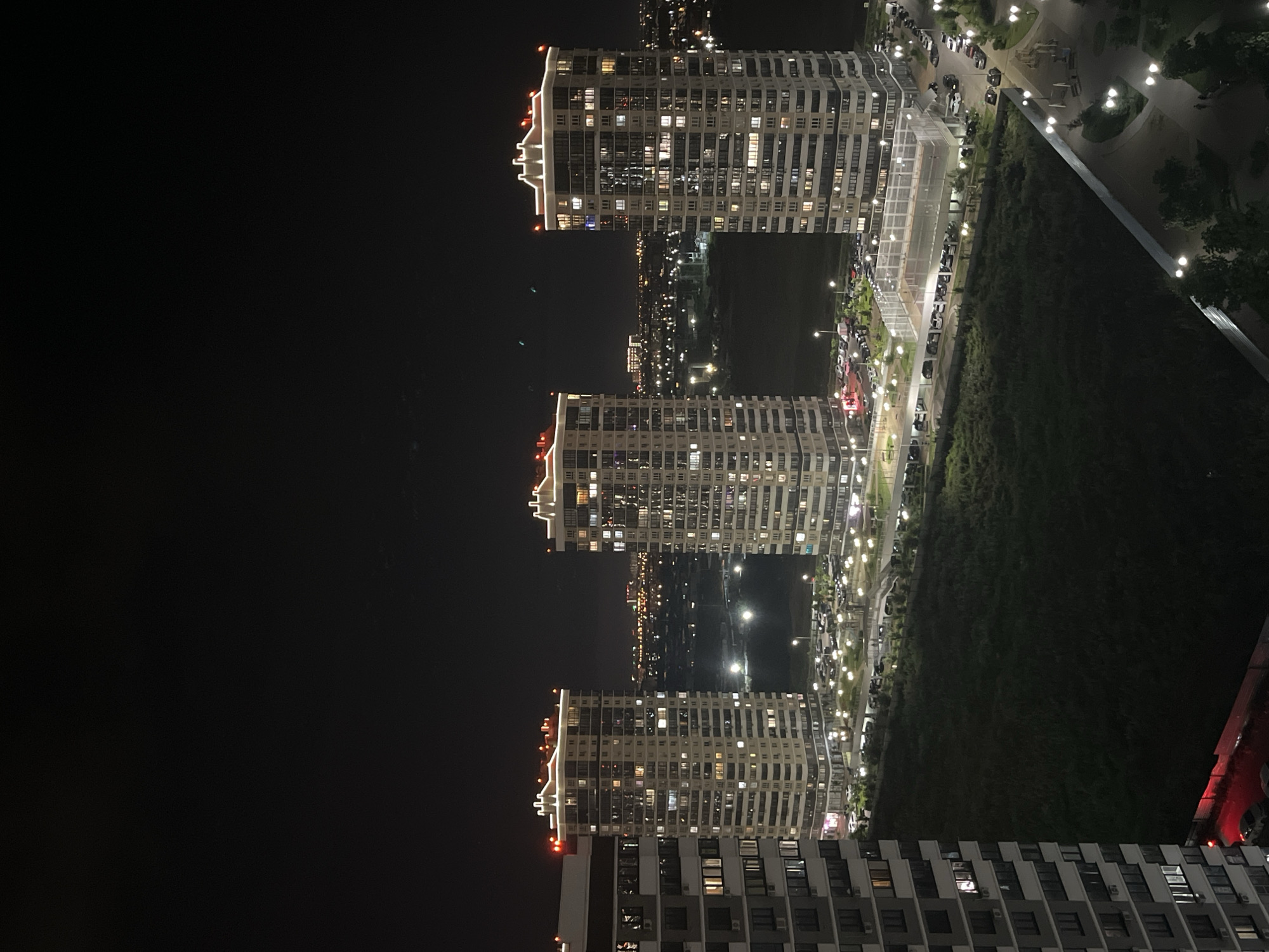 Nighttime aerial views of residential towers and an Orthodox church