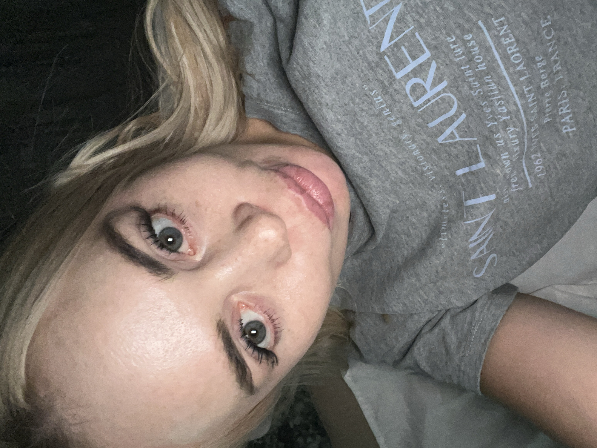 Extended bedroom selfie session in a Saint Laurent sweatshirt.