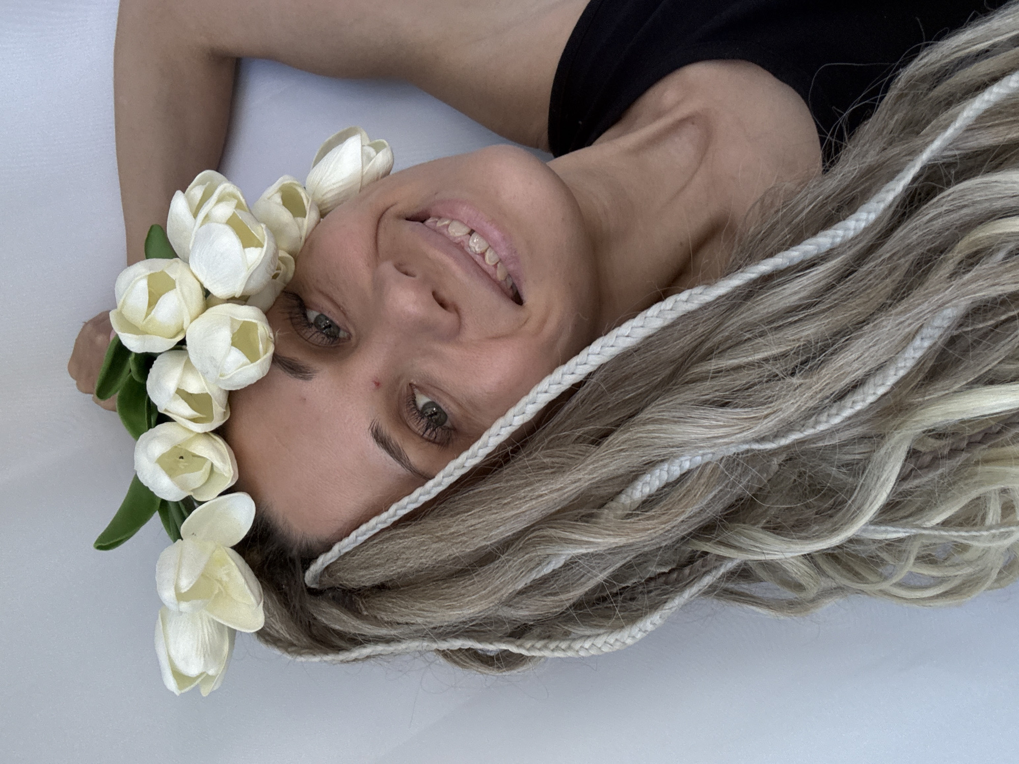 Woman poses for photo session with flowers in Rusanovo