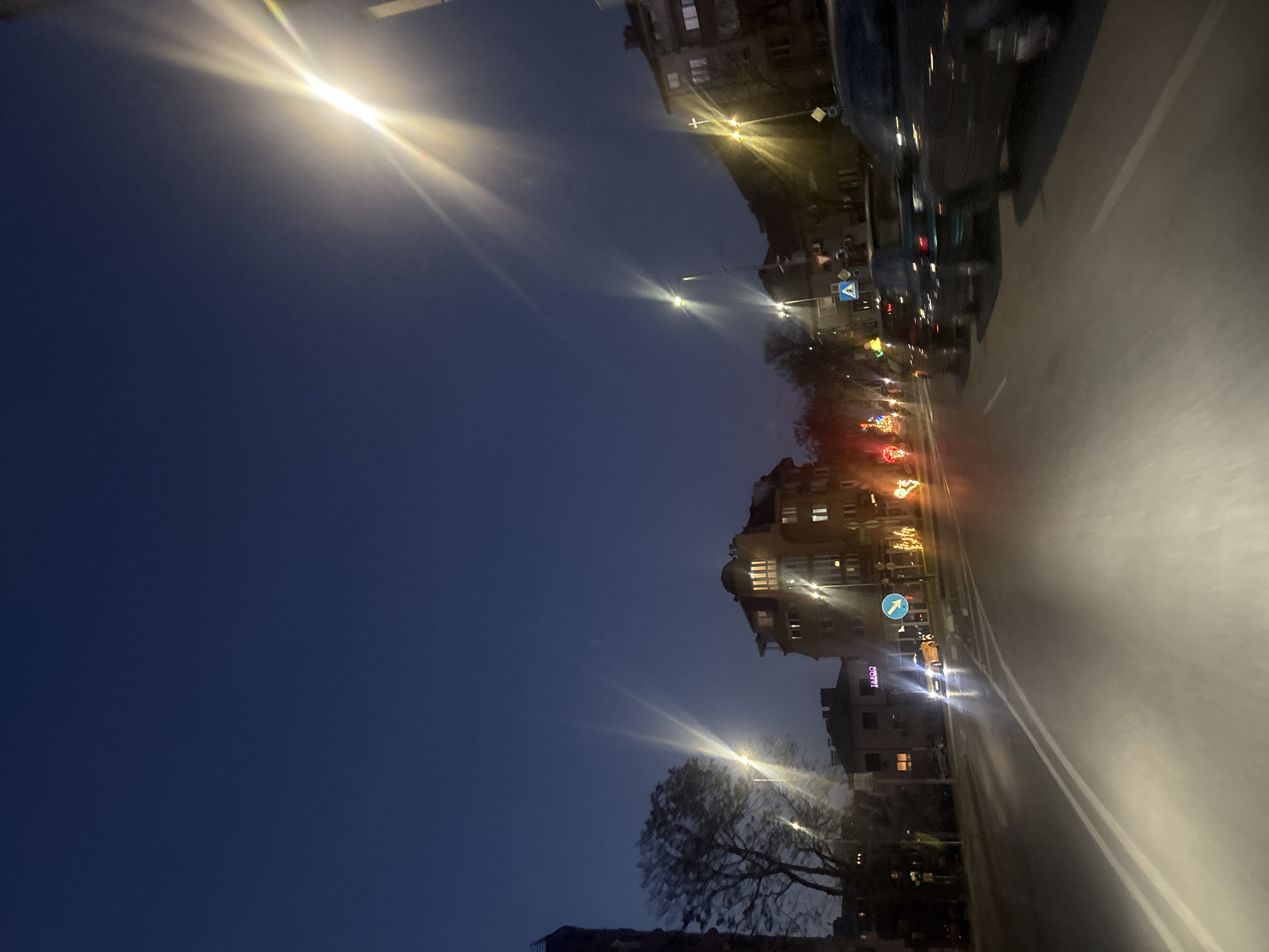 Evening traffic moves through illuminated Blagoevgrad streets