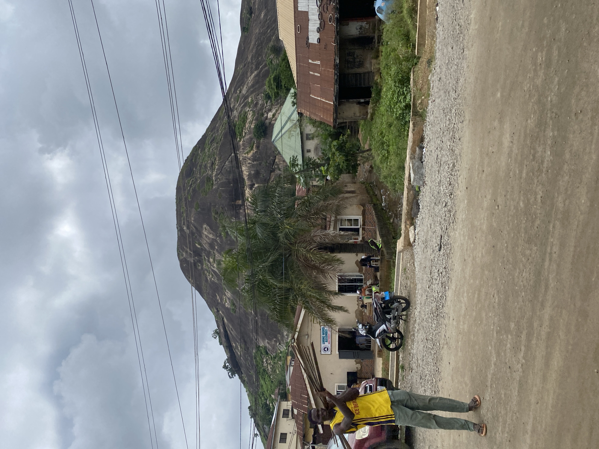 Religious landmarks and rocky terrain along Suleja's dirt roads