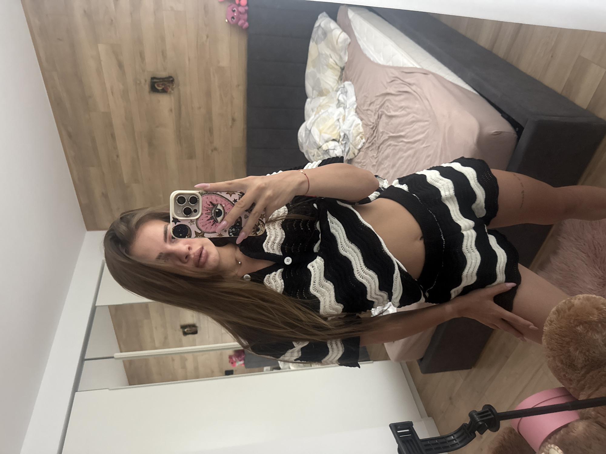 Young woman captures personal photo session in bedroom setting