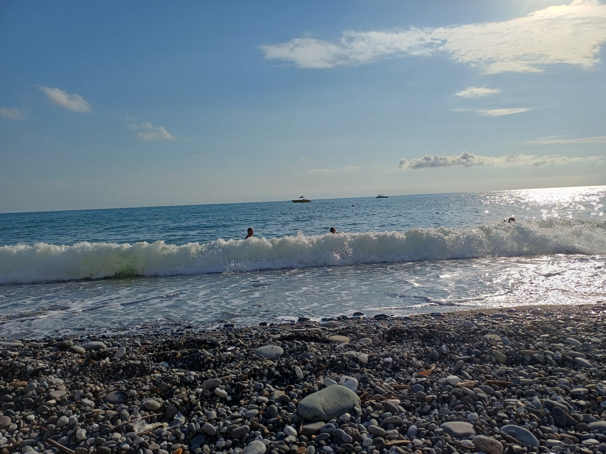 Sunny afternoon on Sochi's Black Sea pebble beach