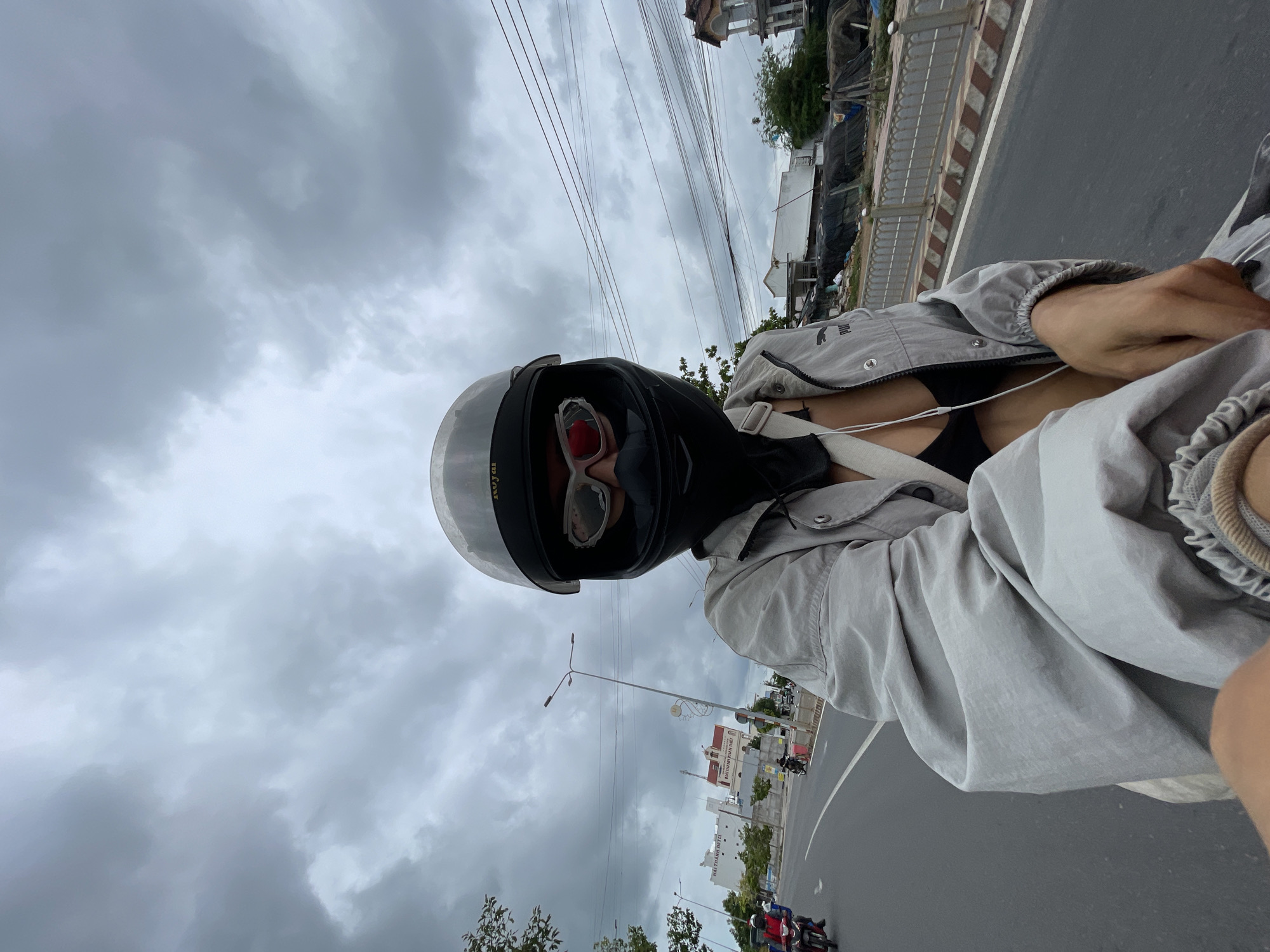 Motorcycle ride through Phu Thuy Ward on a cloudy day