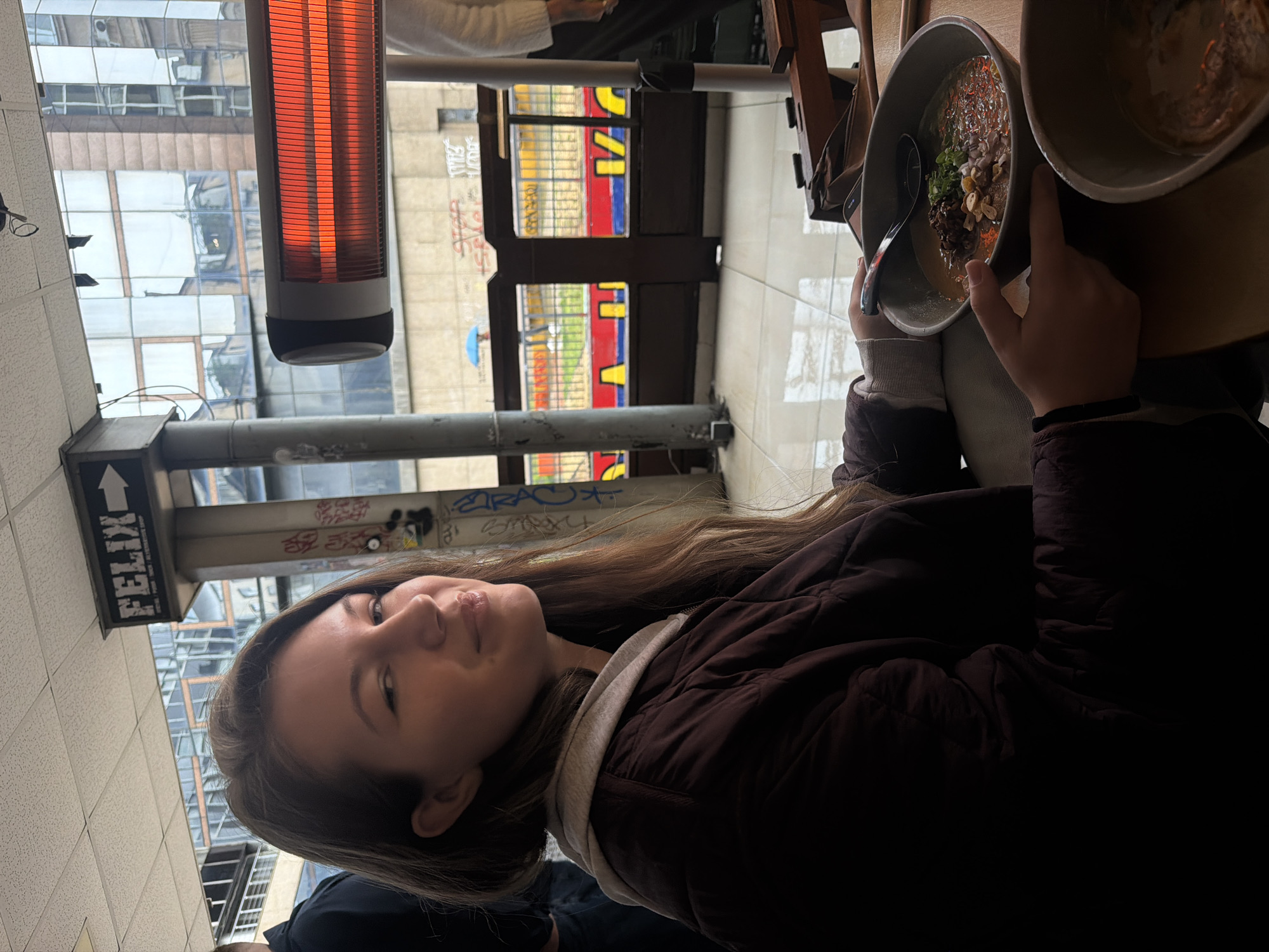 Lunch patron enjoys ramen and beer at Belgrade restaurant